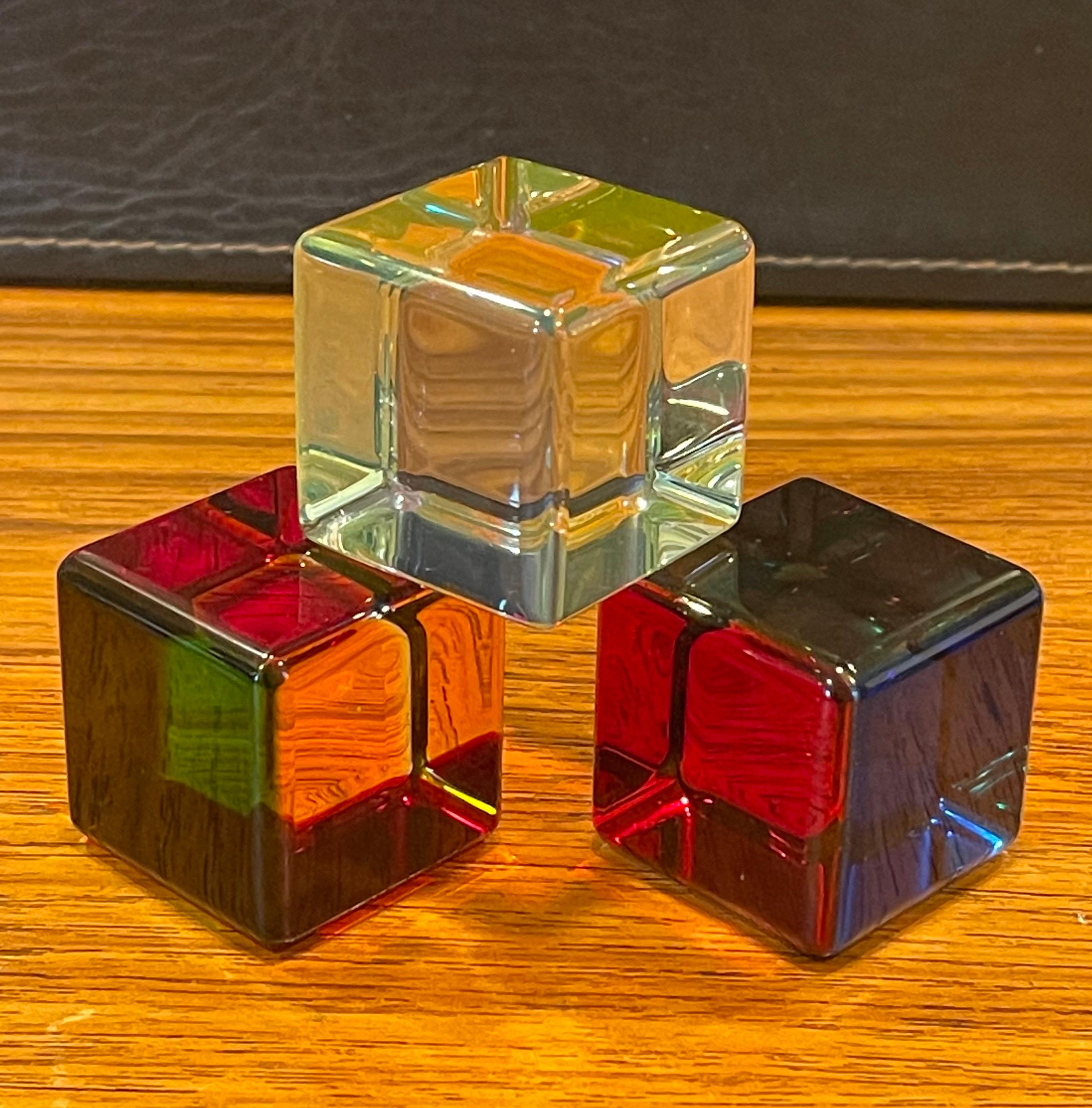 Nice set of three Op Art acrylic cube sculptures with original box (VM Ware) and brochure by Vasa Mihich, circa 2013. The look of each cube is changed by rotating the piece and letting the light refract at different angles; there are literally
