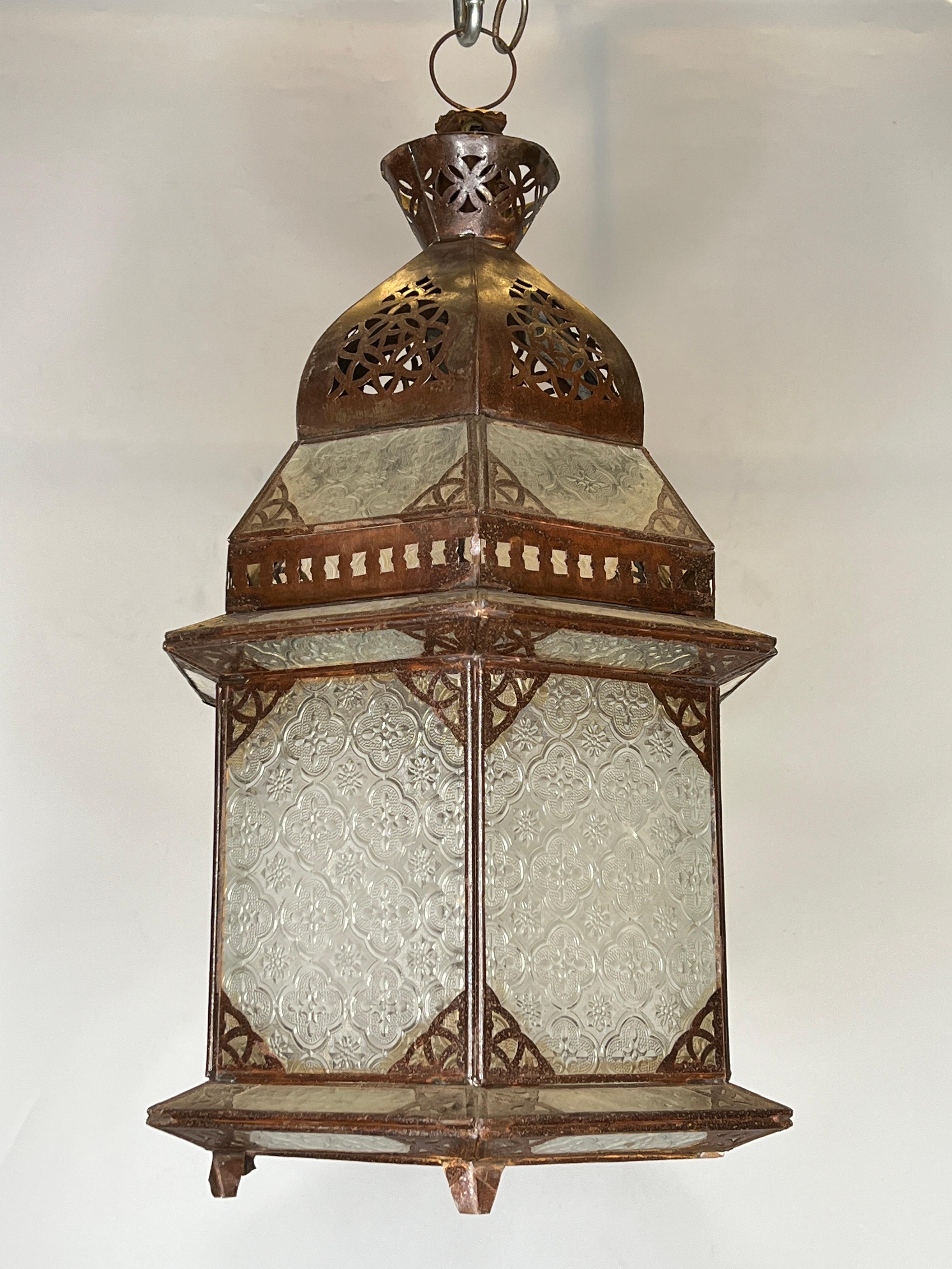 Set of three oriental style metal and glass lanterns, two with ceramic sockets and wiring, one without socket.