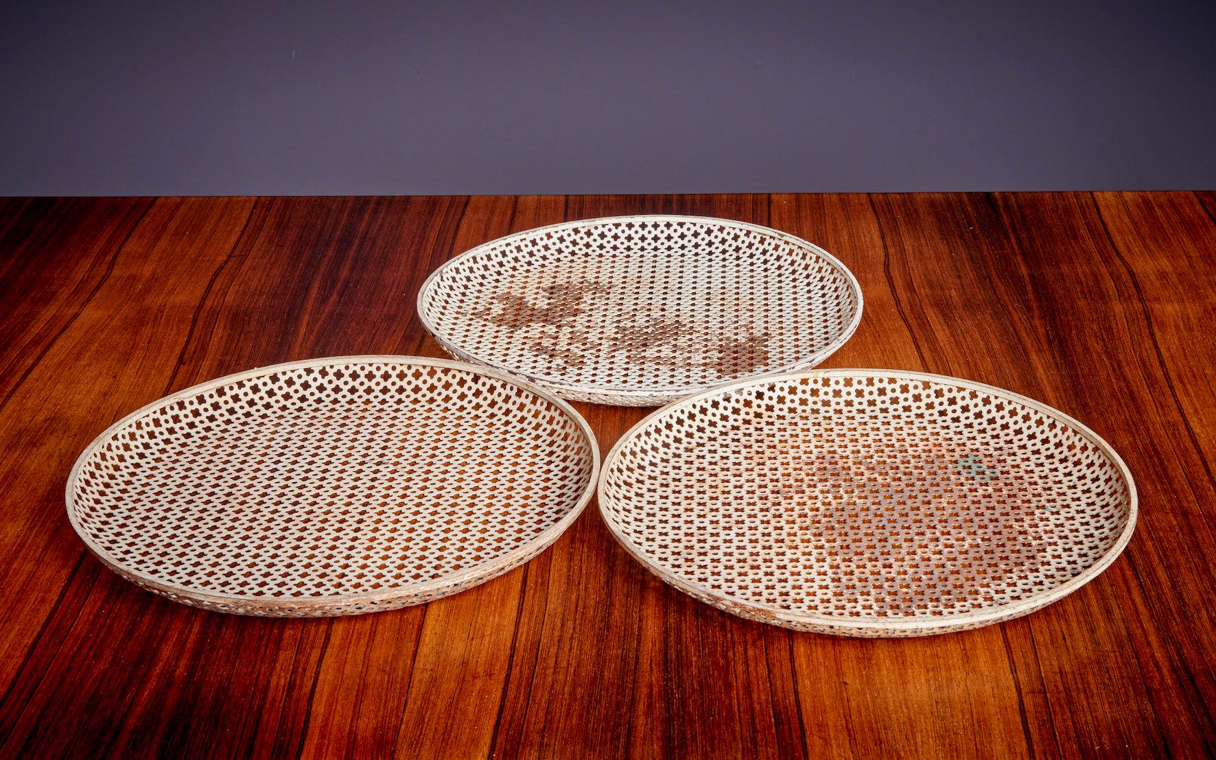 Nice matched Matégot vintage set in vintage condition.

Mathieu Matégot (1910-2001) was a Hungarian-born French designer and artist. He is known for his innovative use of metal tubing and perforated metal sheets, which he incorporated into his