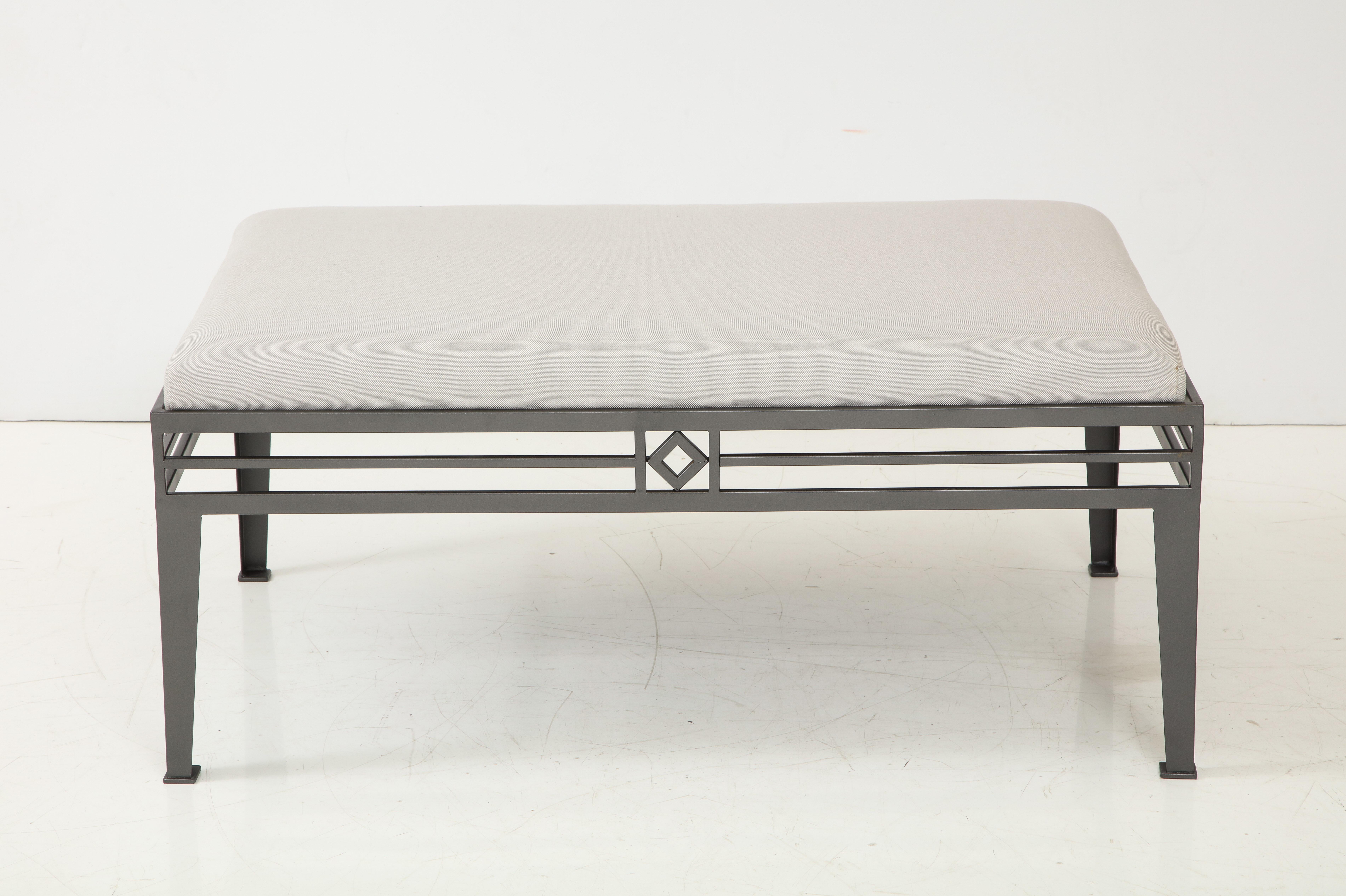 Set of three outdoor benches.
The Geometric design Aluminum frame has been newly re powder coated in a steel gray finish.
The cushions have also been newly reupholstered in as sunbrella fabric.
