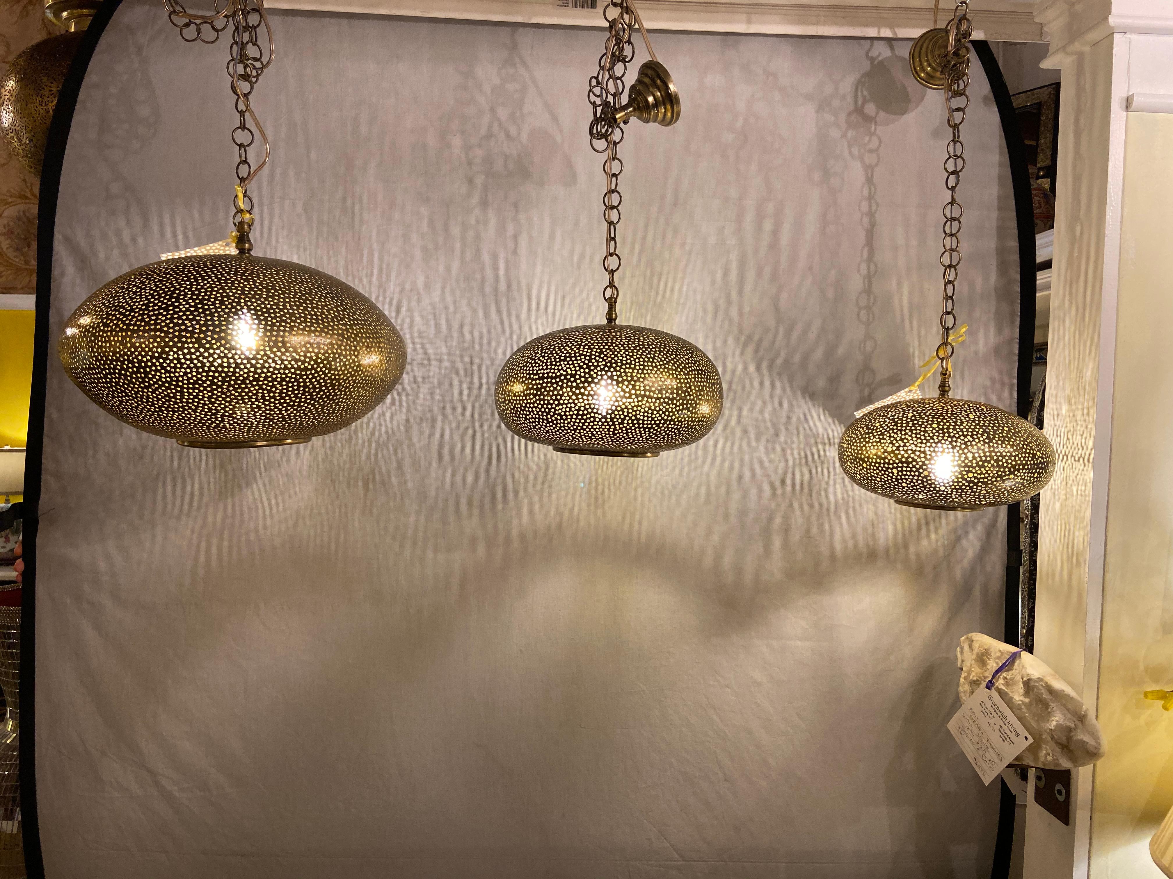 Moorish Set of Three Oval Shaped Brass Pendant Chandeliers in Graduating Sizes