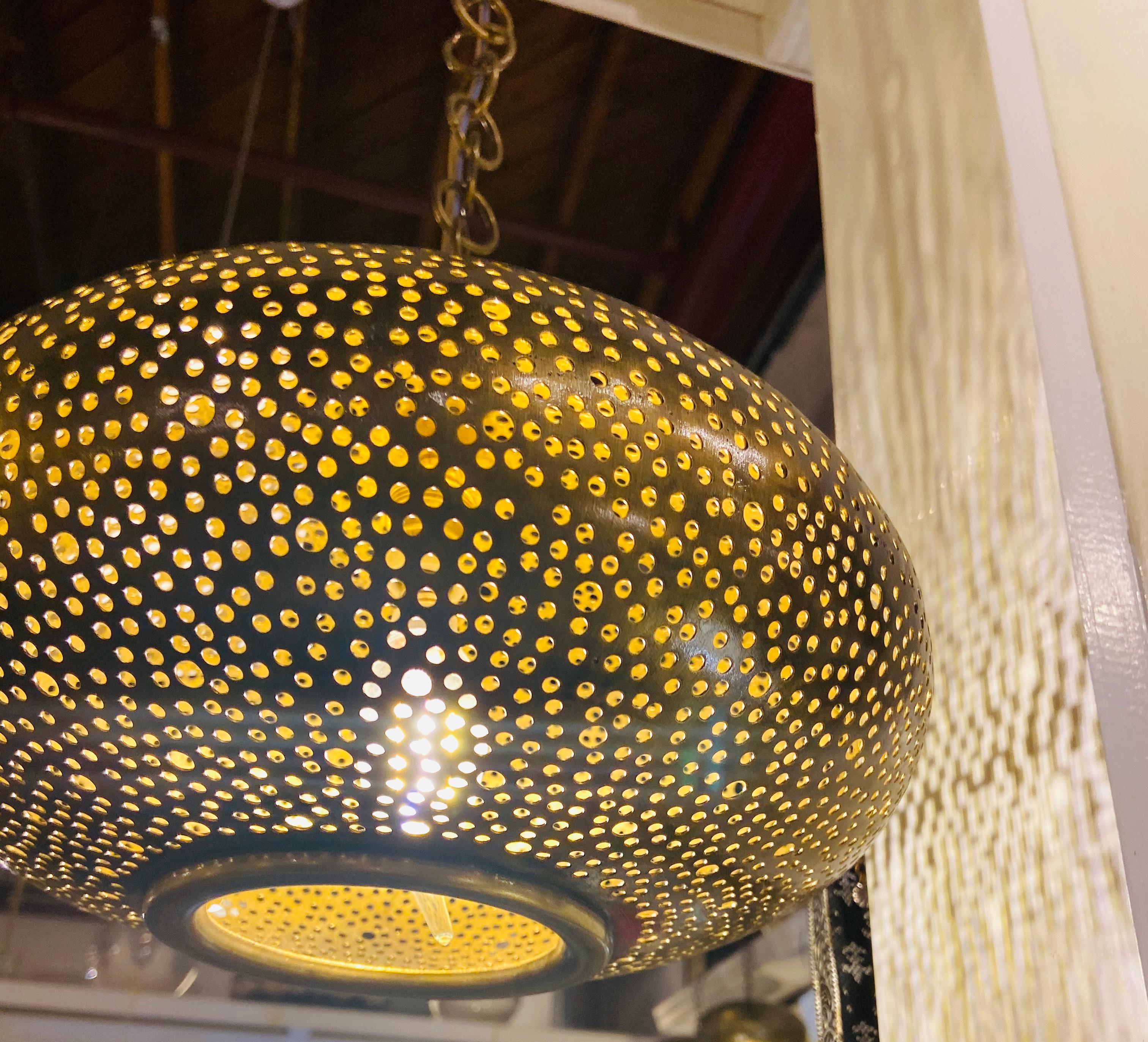 Late 20th Century Set of Three Oval Shaped Brass Pendant Chandeliers in Graduating Sizes