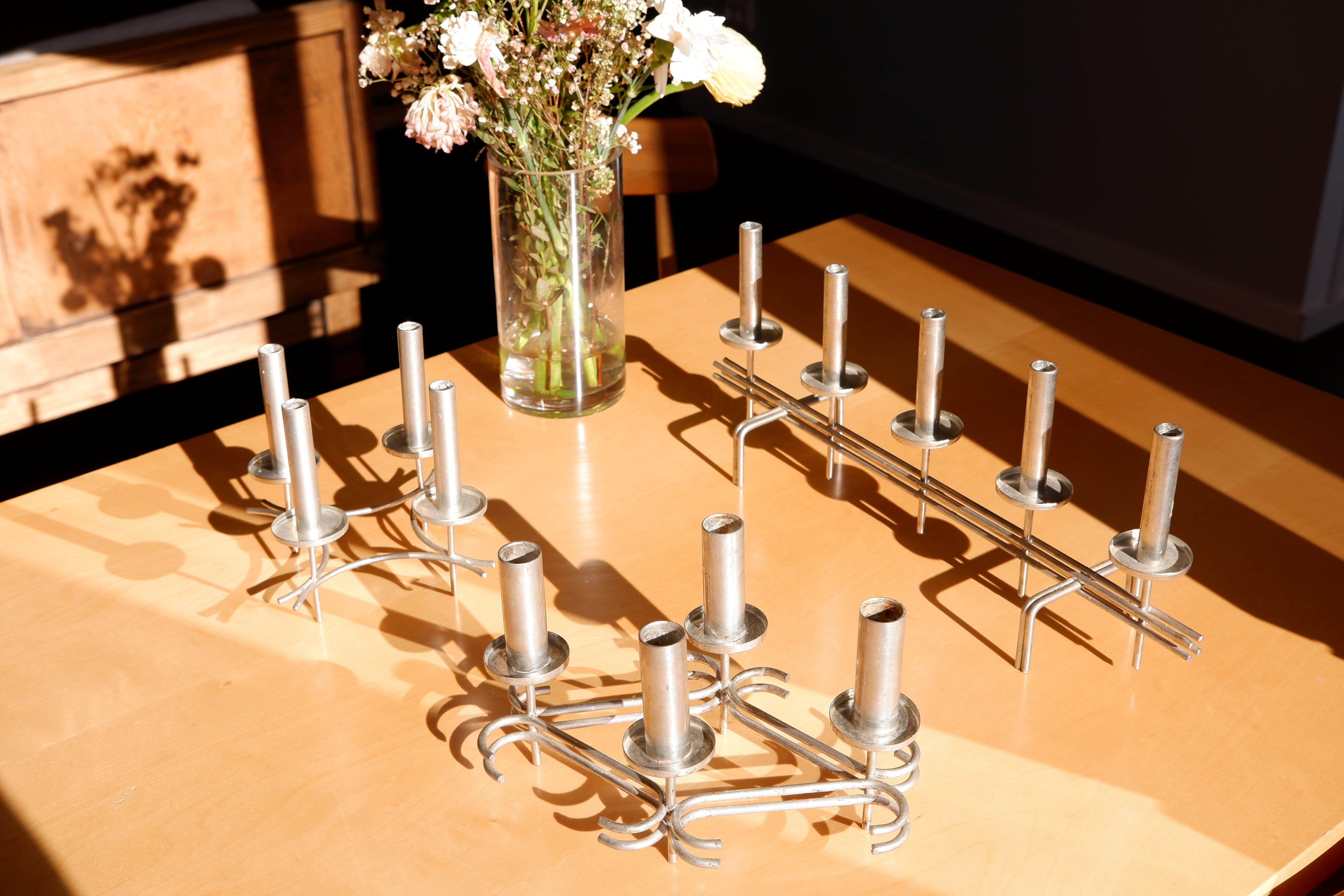 After retirement, Paavo Tynell continued to conduct his own project and design by making those candelabres by himself in the late 60's. He produced a small collection of those in nickel brass. Those candelabre can really be seen has handmade design