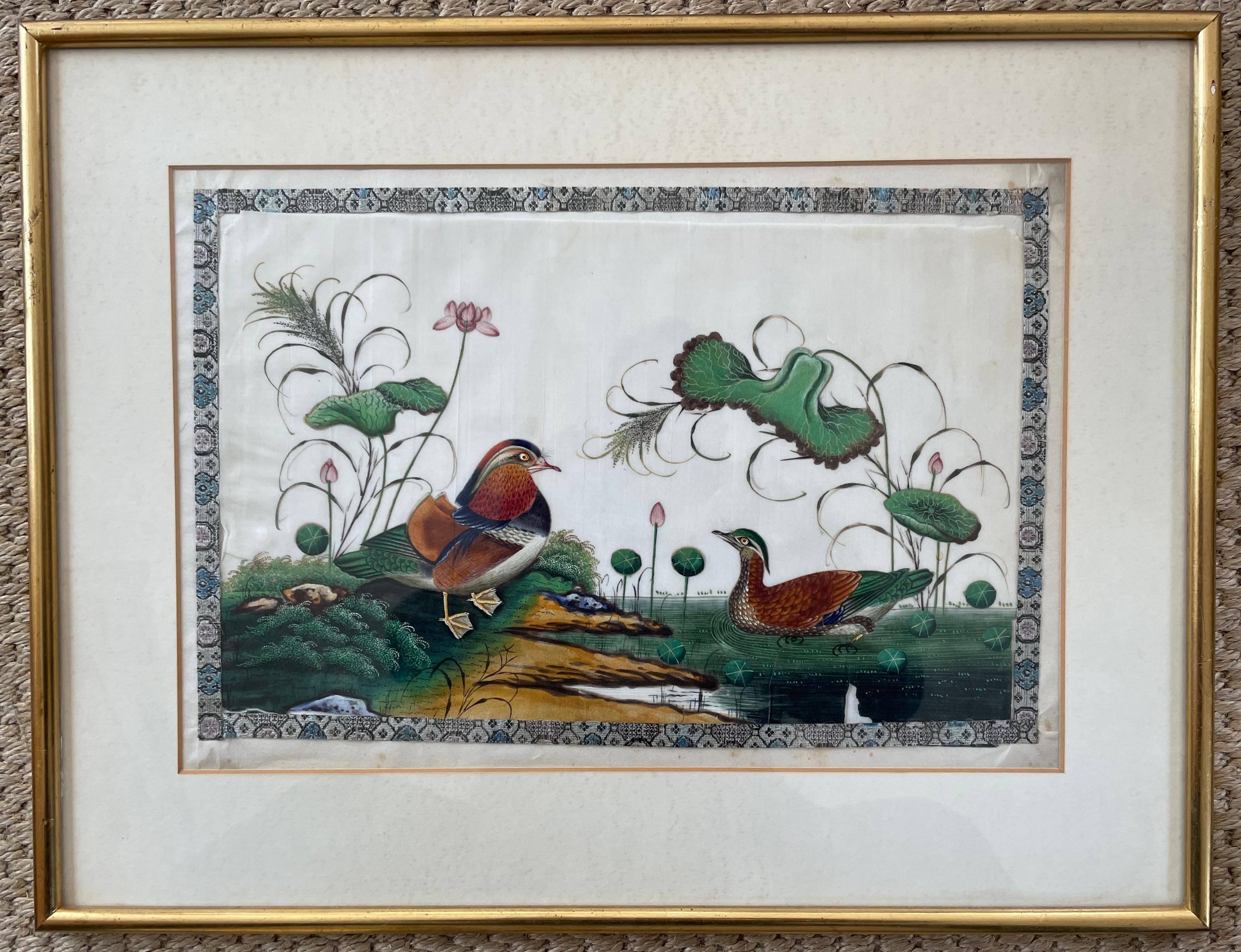 Set of three painted silk bird paintings. Set of three Chinese silk painted bird pictures with embroidered border, framed in later gilt frames including oriental mandarin ducks, parrots and lyre birds. China, late 19th century 
Dimensions: 18.75” W