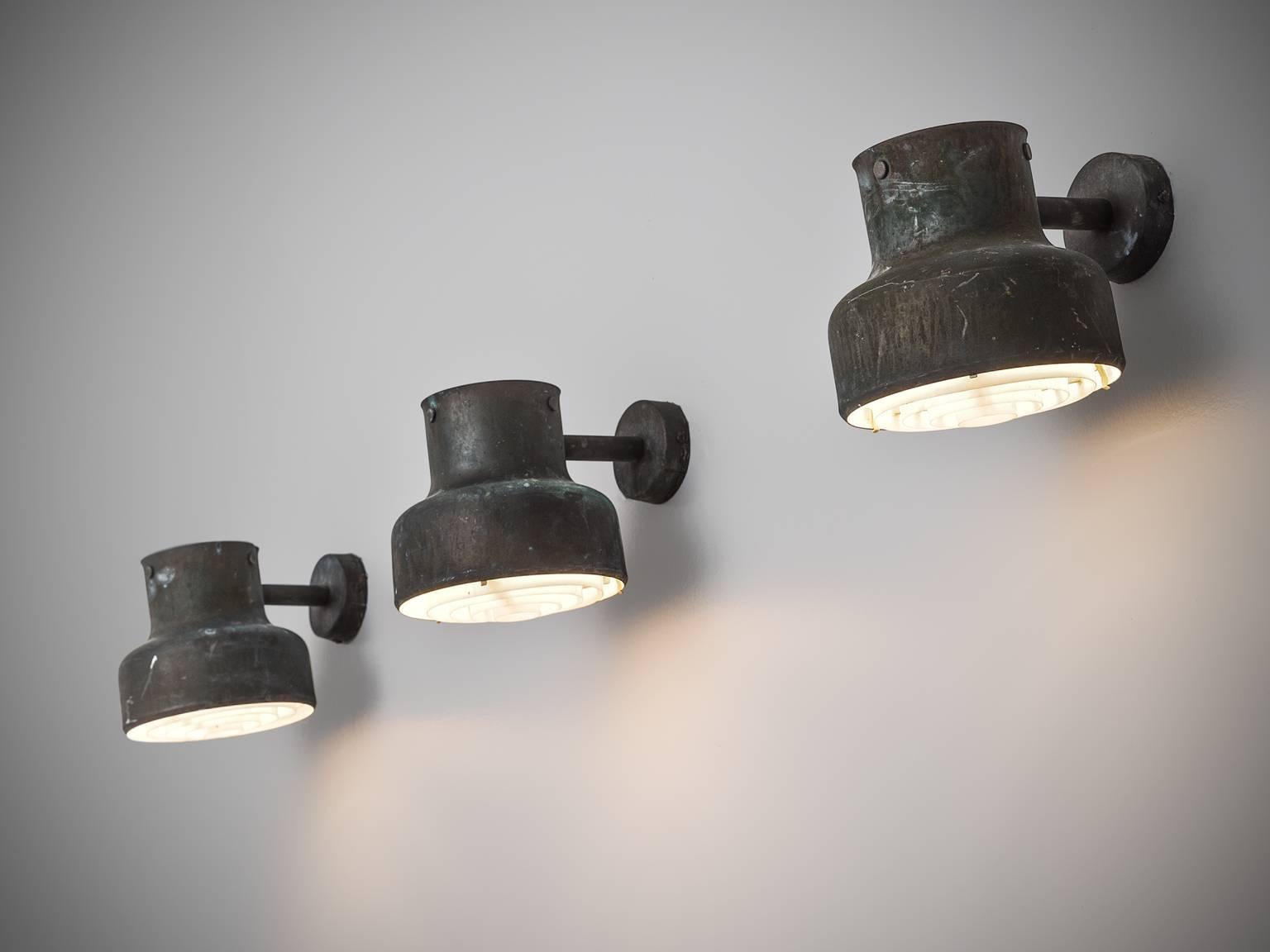 Set of three 'Bumling' wall lights, in metal and plastic, by Anders Pehrson for Ateljé Lyktan, Sweden, 1968.

Set of three patinated copper colored 'Bumling' wall light by Anders Pehrson for Ateljé Lyktan. Well designed industrial wall lights with