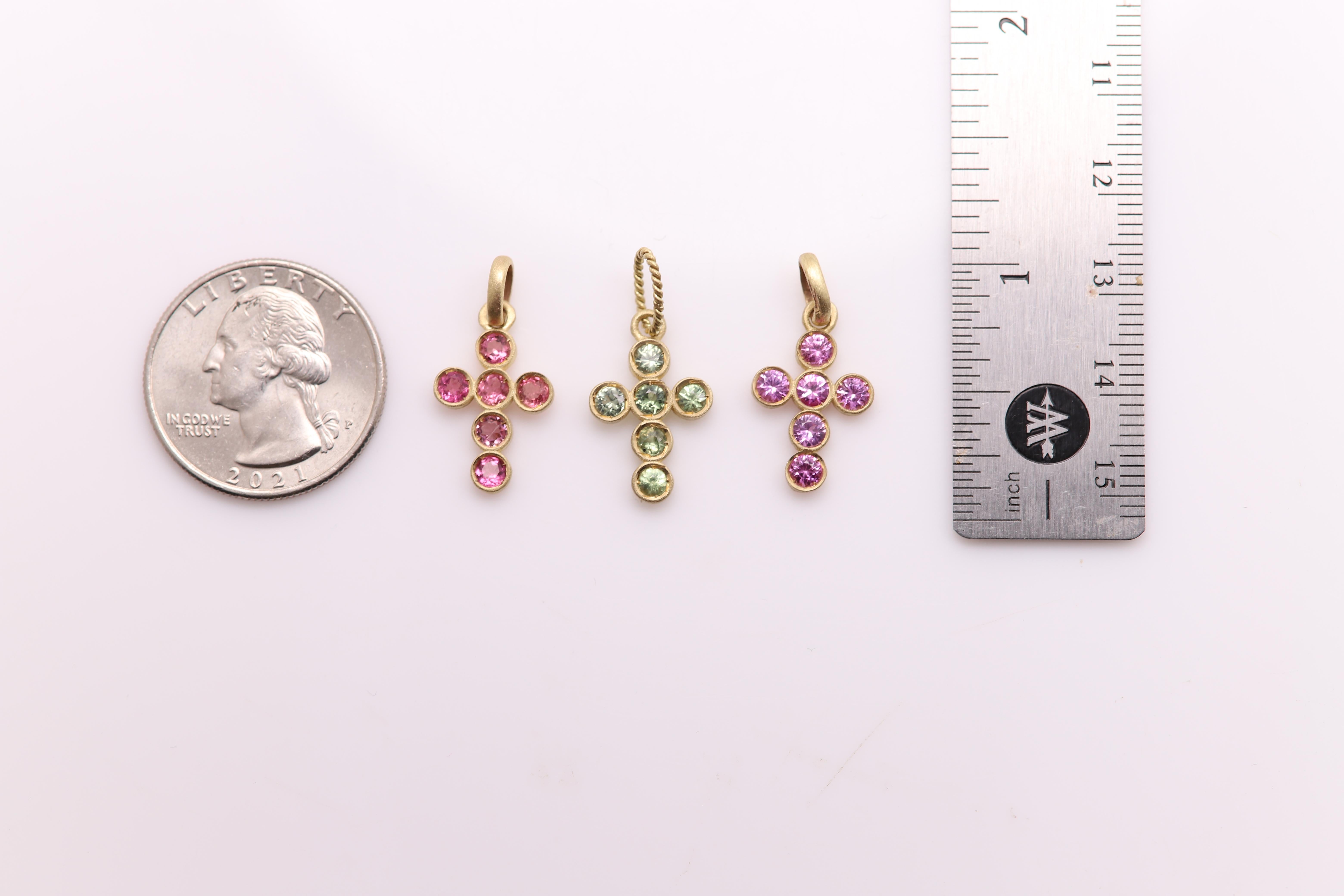 Brilliant crosses Pendants- set of three -somewhat vintage about 20 Years old
very nice color of gems - well made tourmaline gemstones(they sparkle as sapphires) 
1) pink
2) purple-ish
3) light green
Set in 14k yellow gold - brushed finish