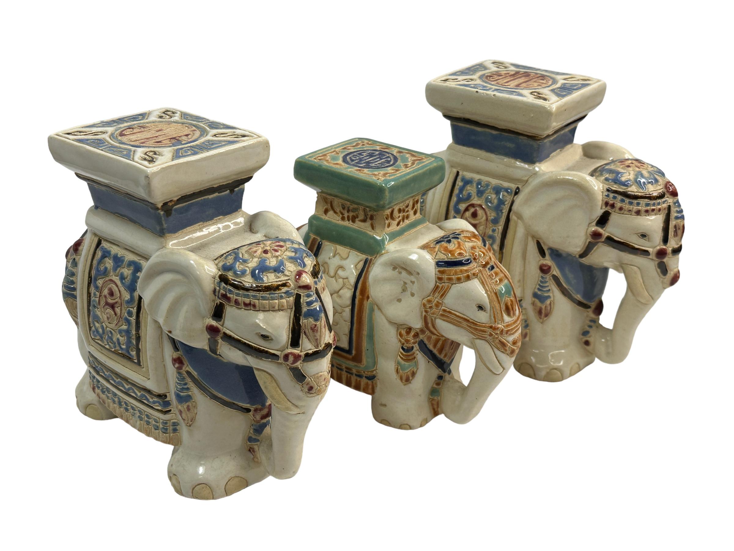 A set of three petite mid-20th century glazed ceramic elephant flower pot seats. Handmade of ceramic. Nice addition to your home, patio or garden. Found at an Estate Sale in Nuremberg, Germany. Two are a matching pair. one is a little smaller. The