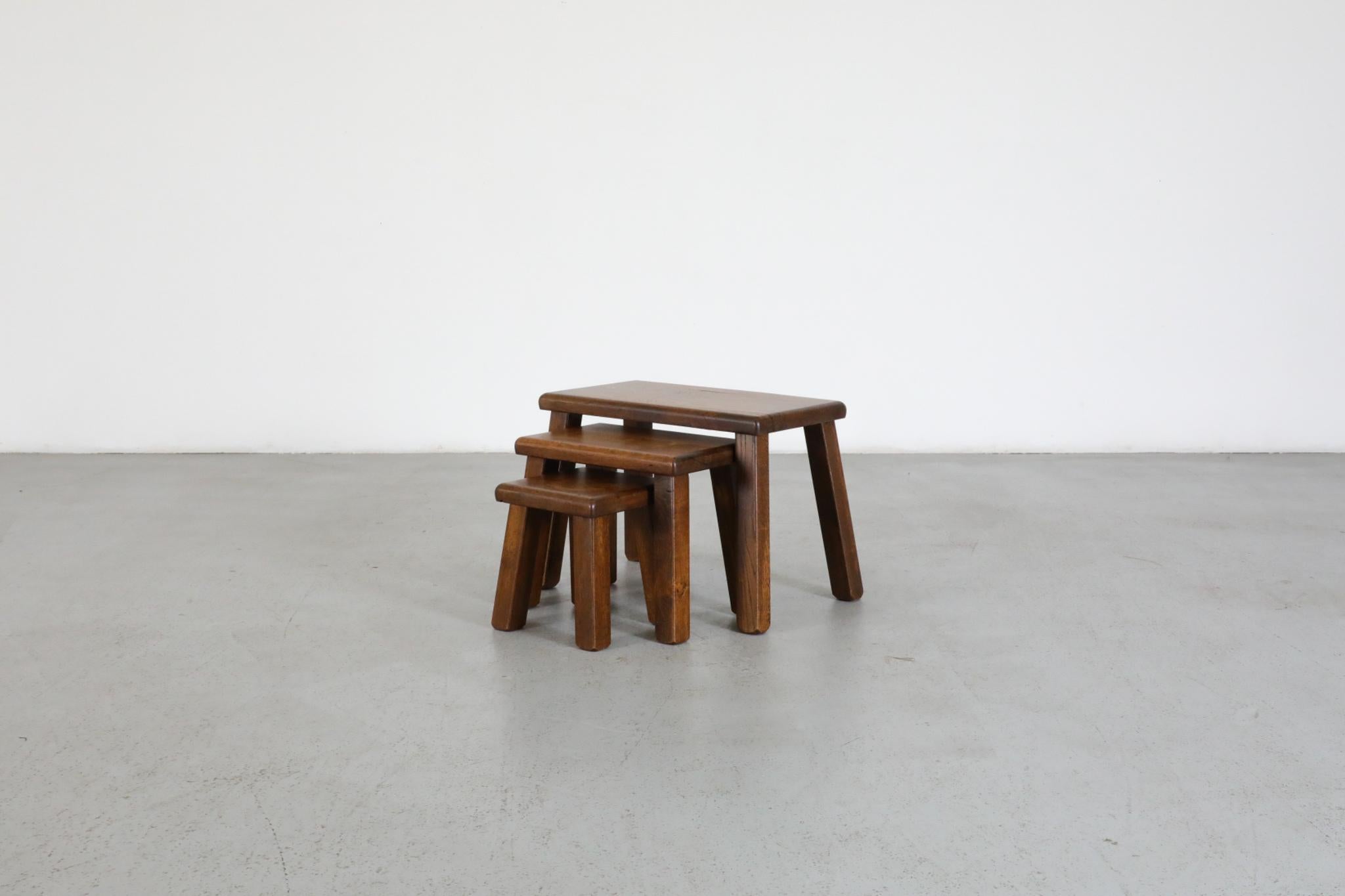 Set of 3 Brutalist Pierre Chapo style rectangular nesting tables. Solid oak, lightly refinished, in good condition with some visible surface wear including scratches and wood loss. Priced as a set. Largest table measures 19.5