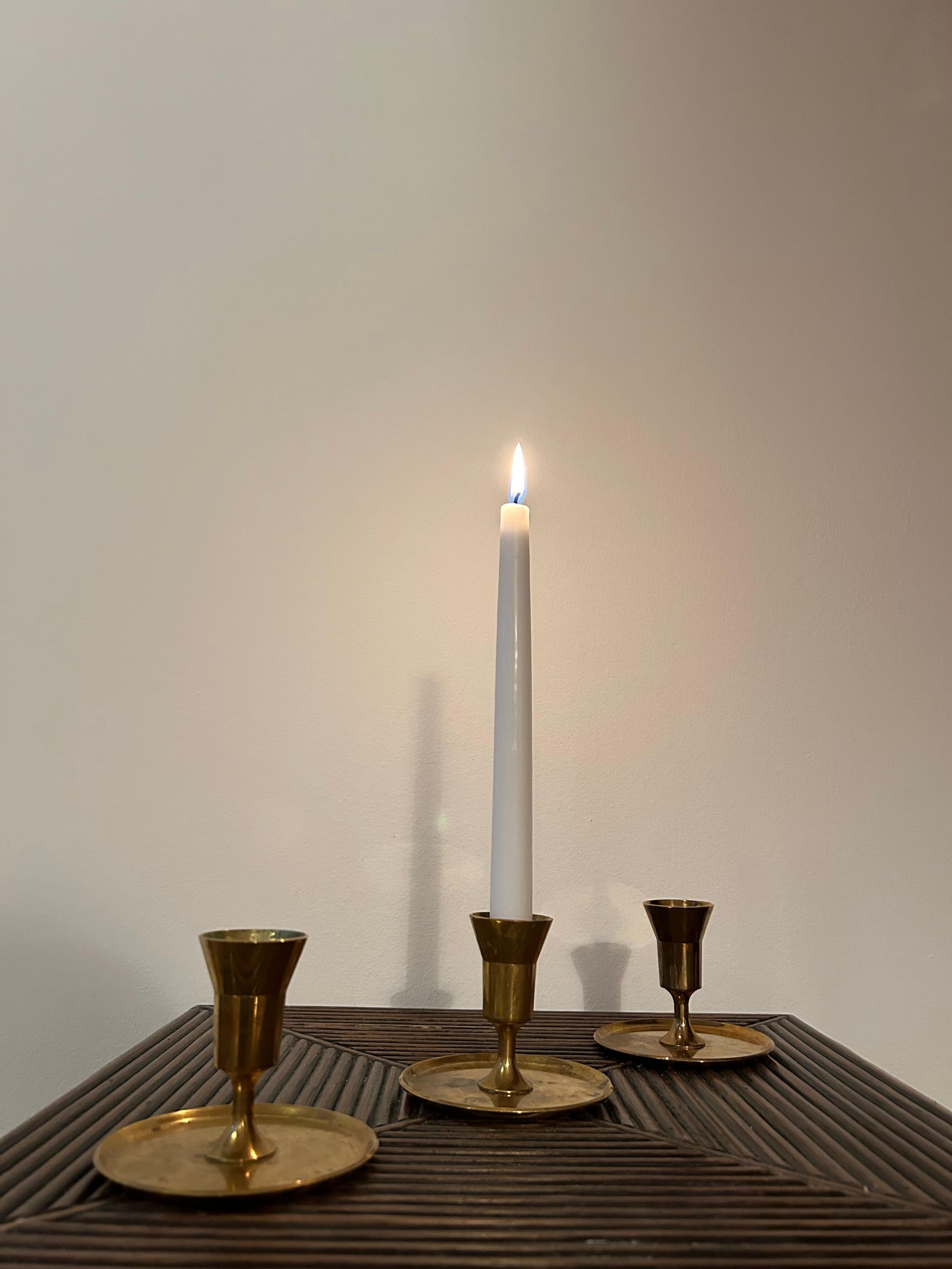 Scandinavian Modern Set of three Pierre Forssell candle sticks in brass For Sale