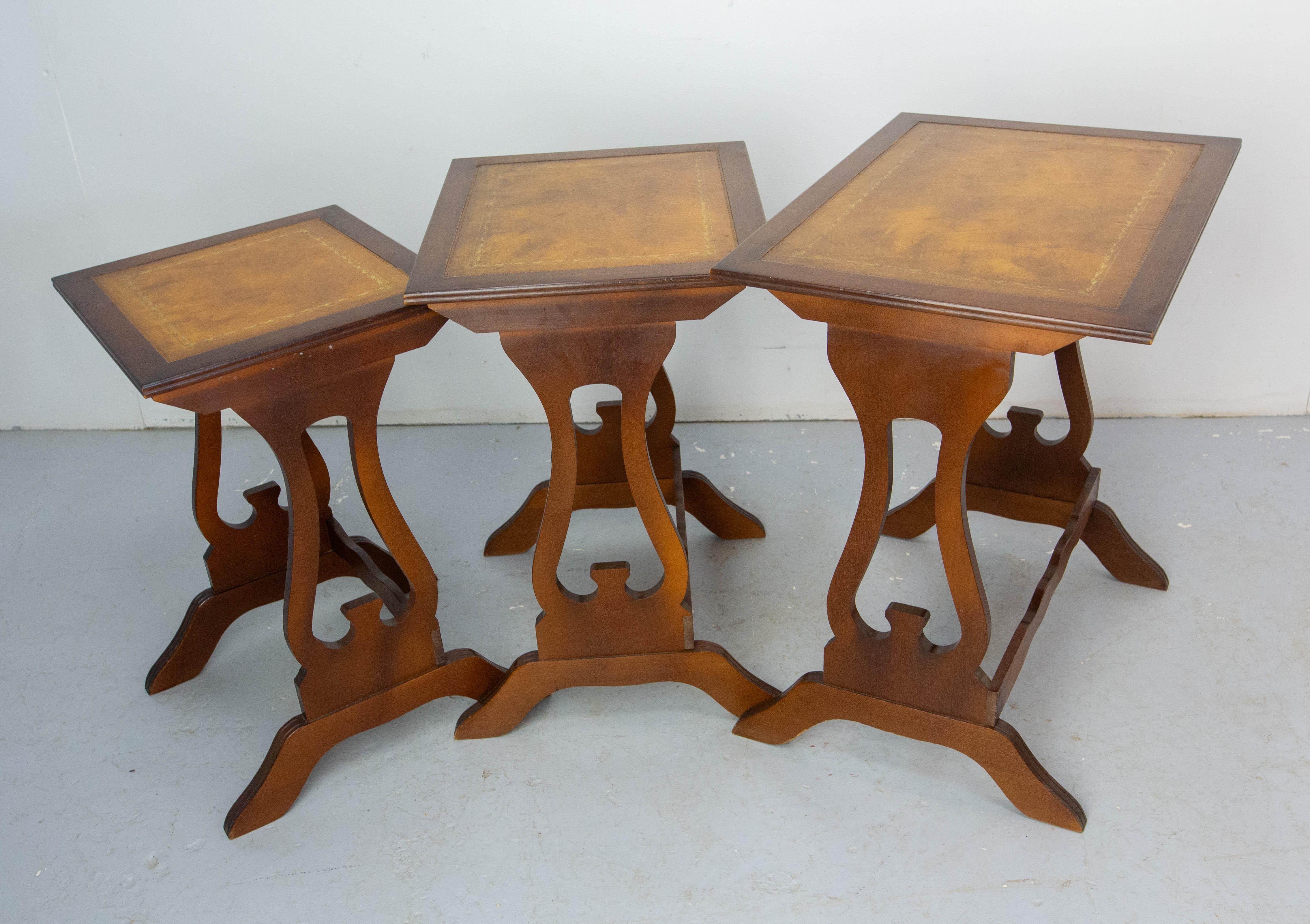 Three nesting vintage tables, French, circa 1960
The poplar tops are recovered of leather. Each leather top is framed by a gold border.
Dimension of the two smaller tops:
13.78 x 16.93 in. (35 x 43 cm)
13.78 x 16.912.60 in. (35 x 32 cm)
Good