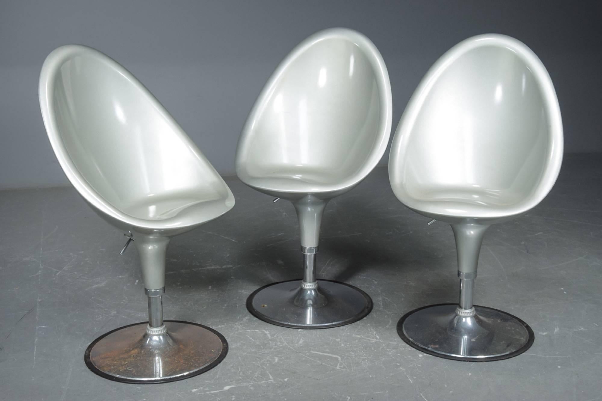 Set of three Postmodern barstools with fiberglass shells and chromed tulip style bases. Seat height is adjustable.