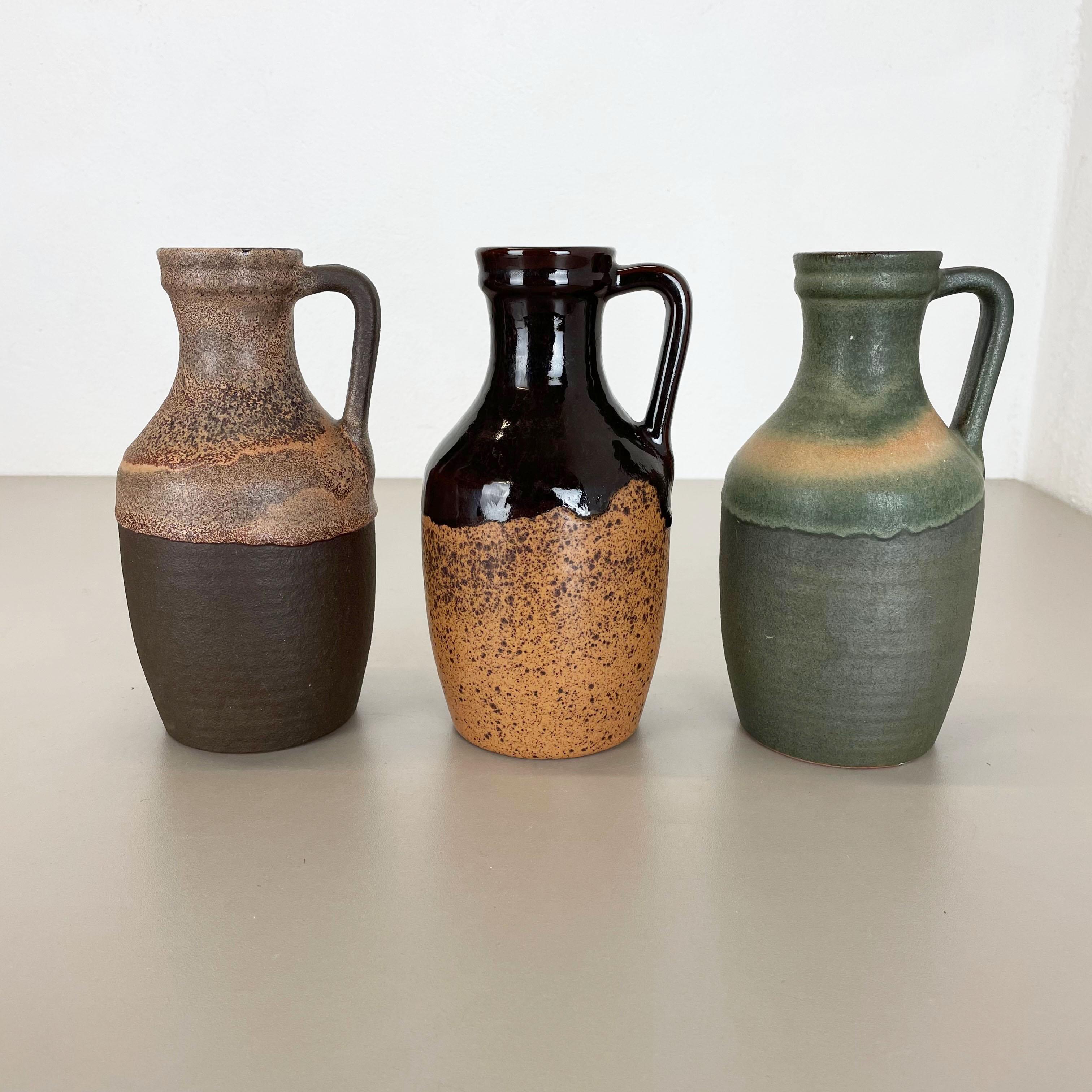 Article:

Ceramic fat lava vases set of 3


Producer:

Marei Ceramics, Germany


Decade:

1970s





Set of 3 original vintage Studio Pottery vases was produced in the 1970s by Marei Ceramics, Germany. Rare set of 3 identical vases