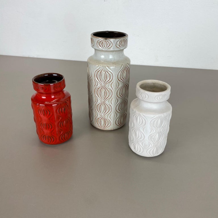 Article:

Set of three fat lava art vases

Model:
285




Producer:

Scheurich, Germany



Decade:

1970s




These original vintage vases was produced in the 1970s in Germany. It is made of ceramic pottery in fat lava optic.
