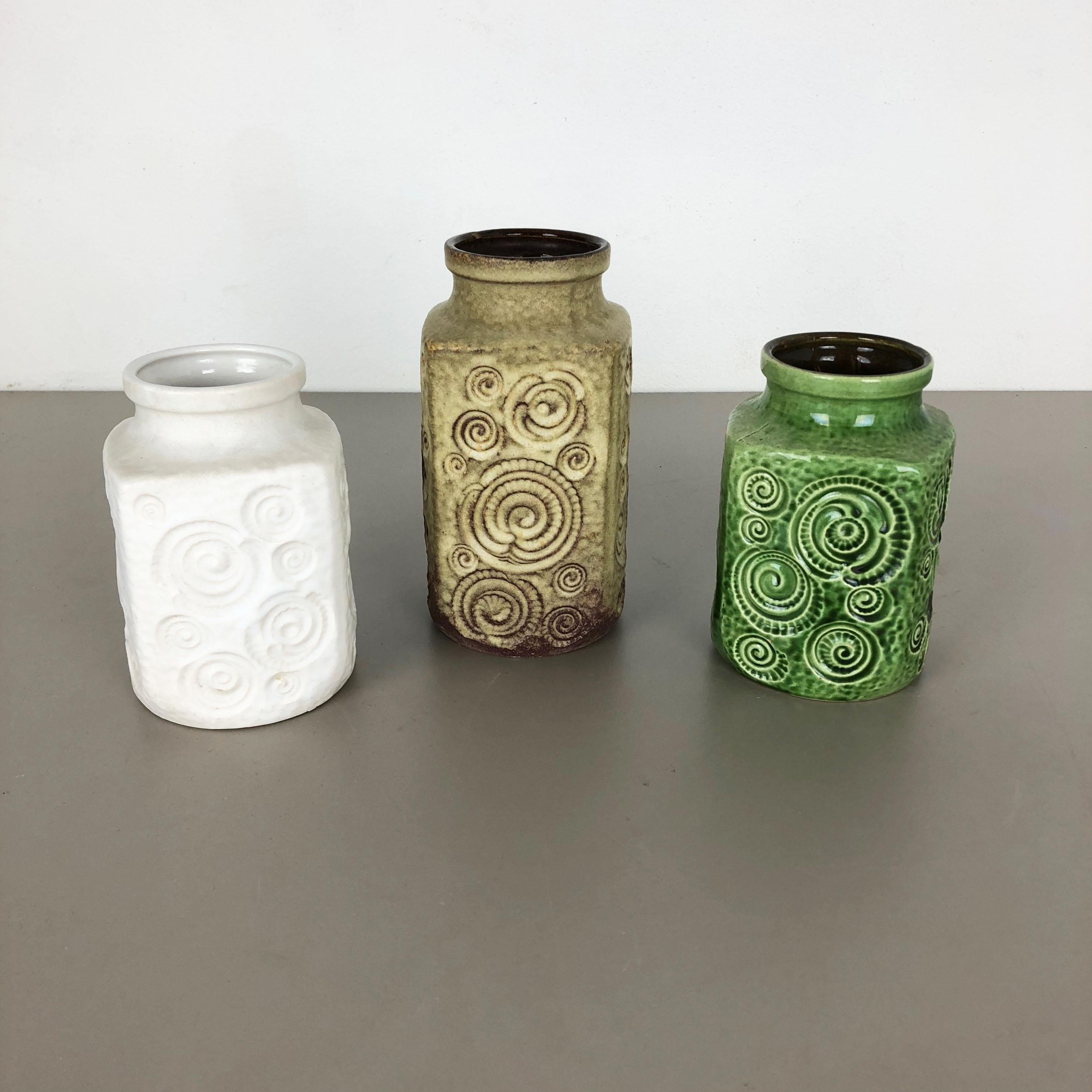 Article:

Set of three fat lava art vases

Model:
282-16
282-20



Producer:

Scheurich, Germany



Decade:

1970s




These original vintage vases was produced in the 1970s in Germany. It is made of ceramic pottery in fat