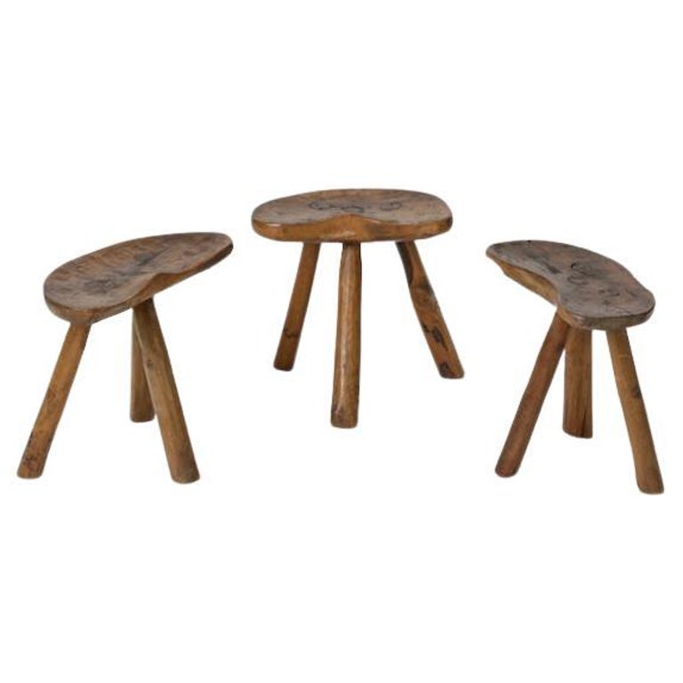 Interesting set of three solid wood stools, made by an Italian craftsman for a Tuscan home in the 1950s.