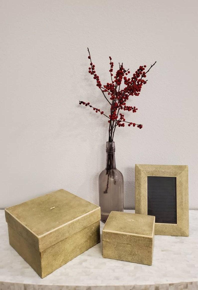 A fine set of three vintage shagreen decorative table-top items by Parisian design label, R & Y Augousti. 

The luxurious set Includes two shagreen covered boxes, a large square lidded box, smaller rectangular box with gently curved dome shaped