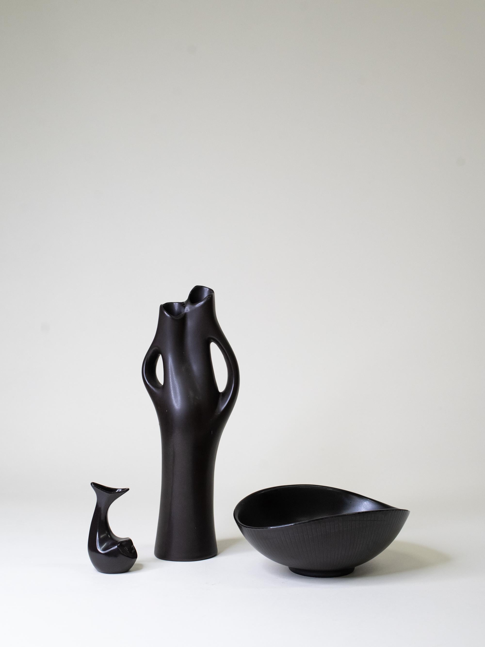 A rare trio from the ‘Mangania’ series, designed by Lillemor Mannerheim and produced by Gefle for Upsala-Ekeby in 1955. Each piece is made of finely crafted stoneware with Mannerheim’s signature satin matte black glaze, a finish that became her