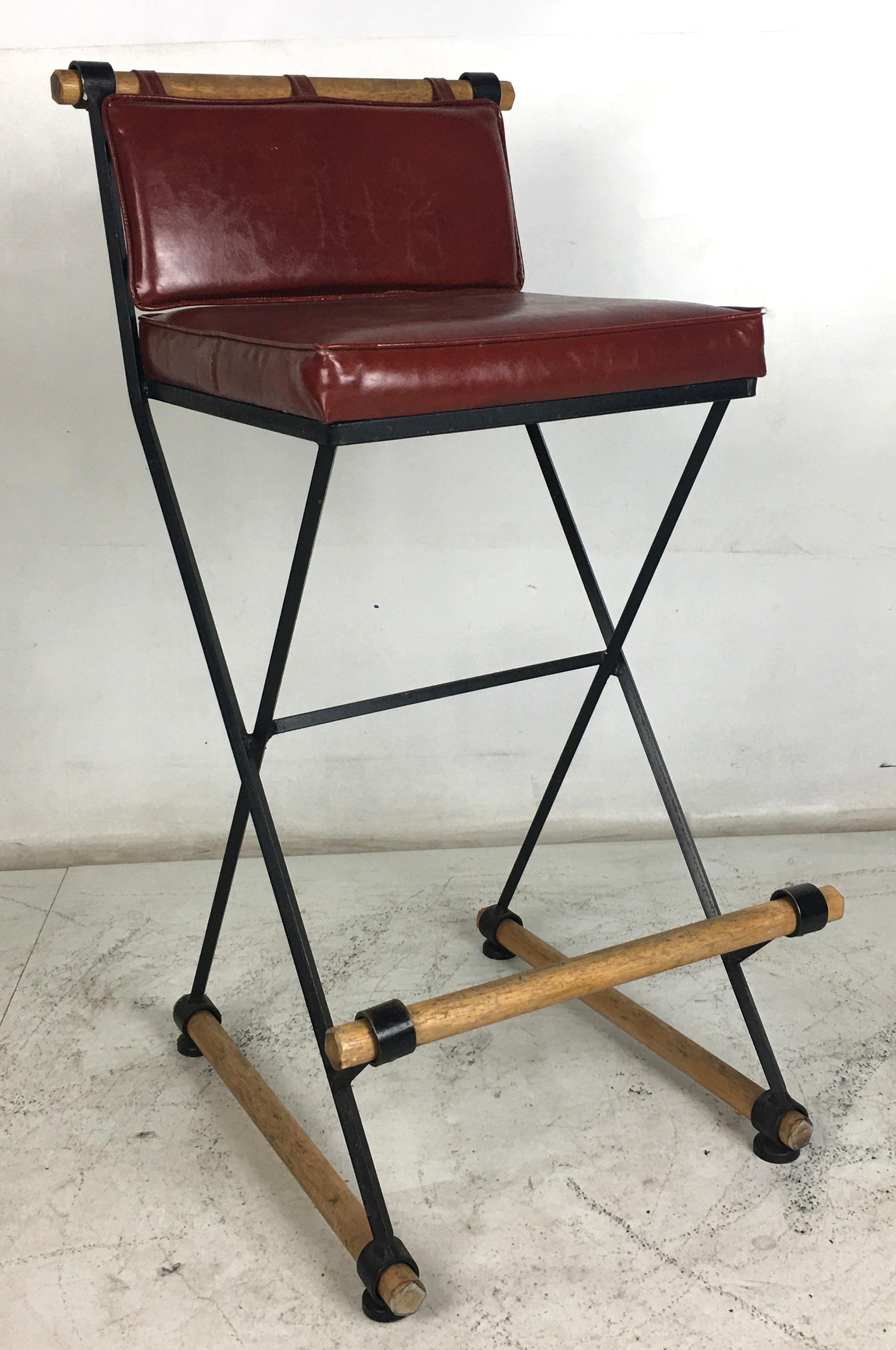 Rare set of Cleo Baldon bar stools with a short backrest and two-piece cushioning.  The seat design makes this model by far the most comfortable Baldon stools.  All of the wooden dowels have been refinished to original but the upholstery is worn and