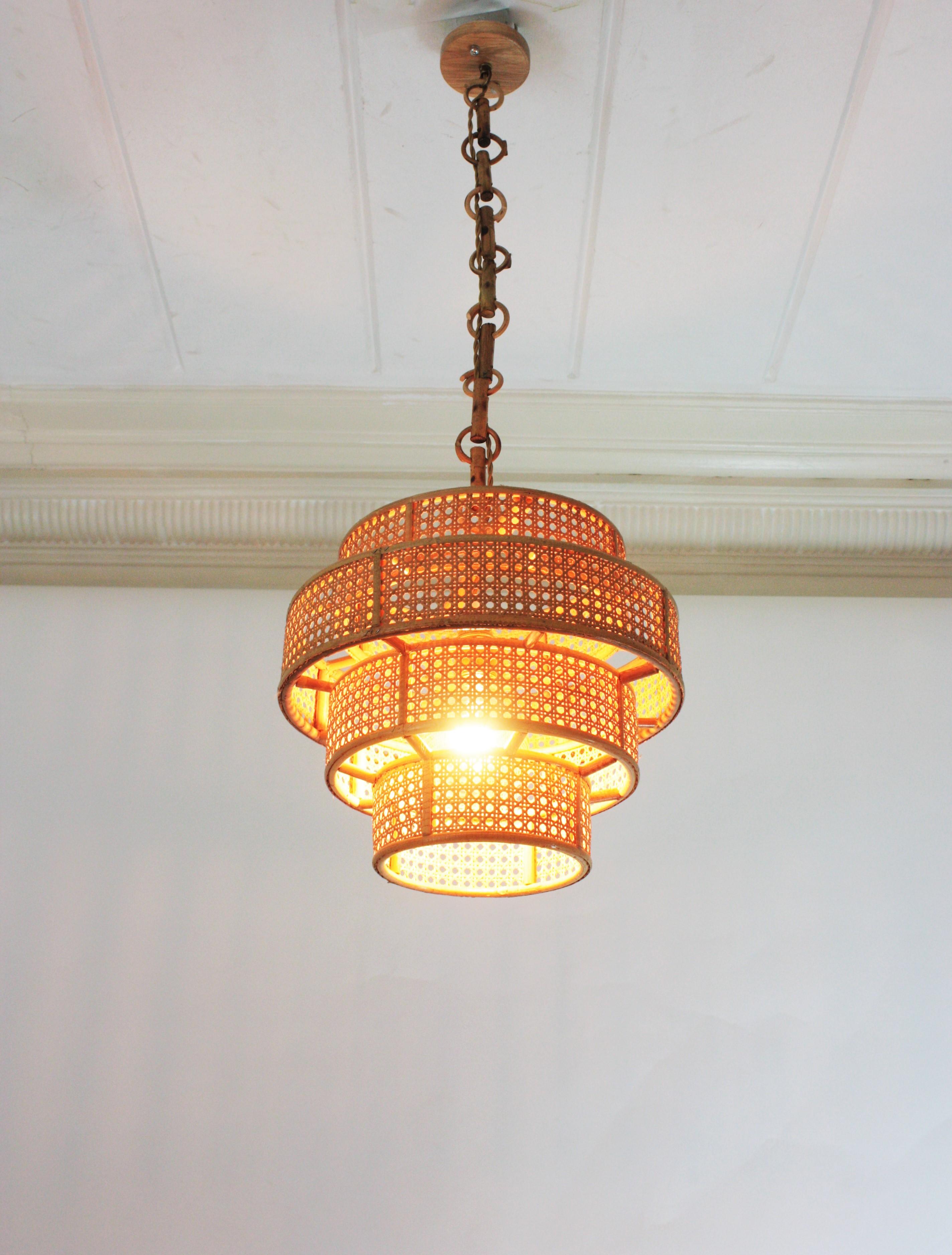 Hand-Crafted Set of Three Rattan Wicker Weave Cylinder Pendant Lights / Lanterns For Sale