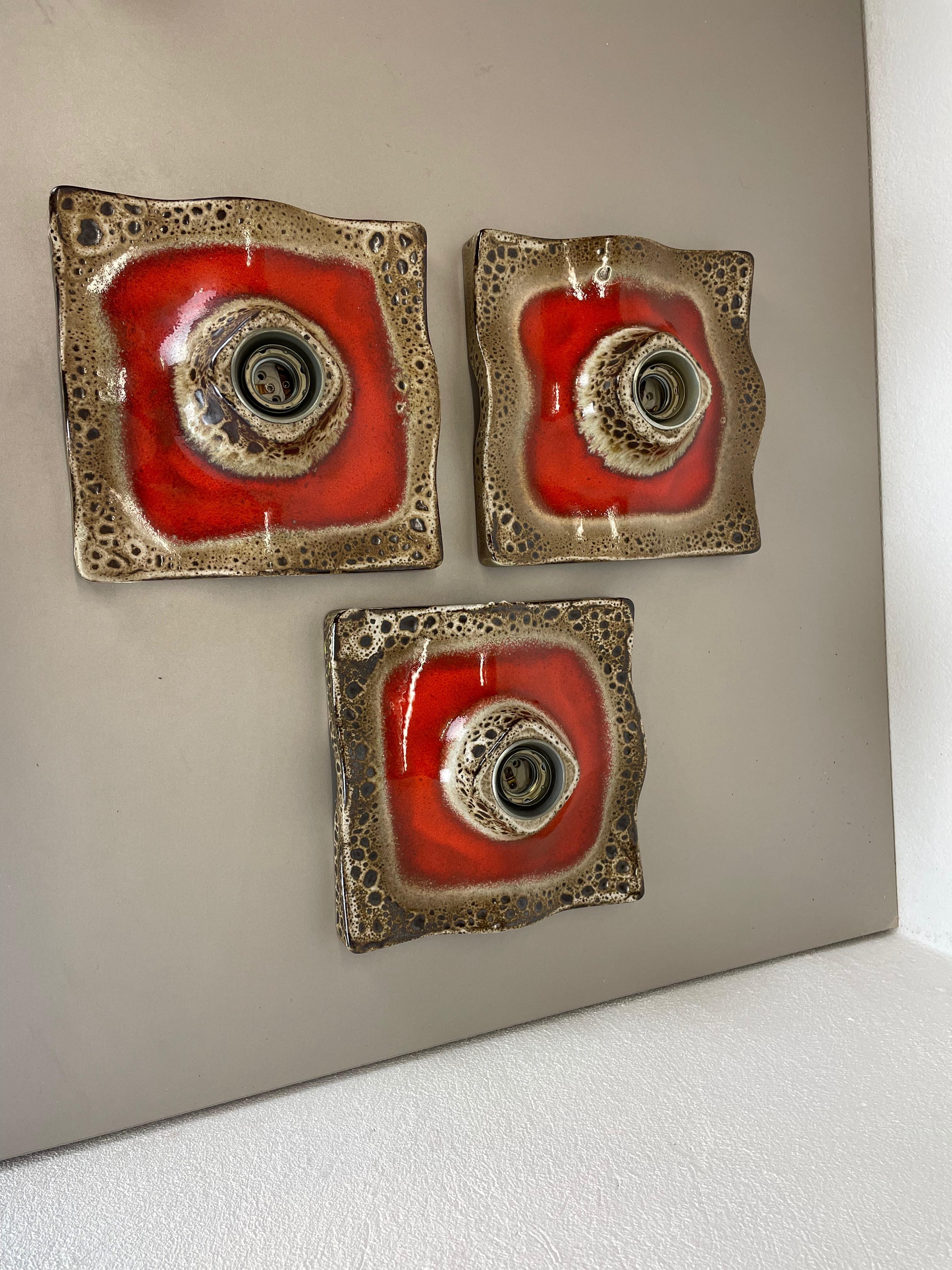 Article:

Wall light sconce set of three.


Producer:

Pan Ceramic, Germany.



Origin:

Germany.



Age:

1970s.



Description:

Original 1970s modernist German wall light made of ceramic in fat lava optic. This super rare