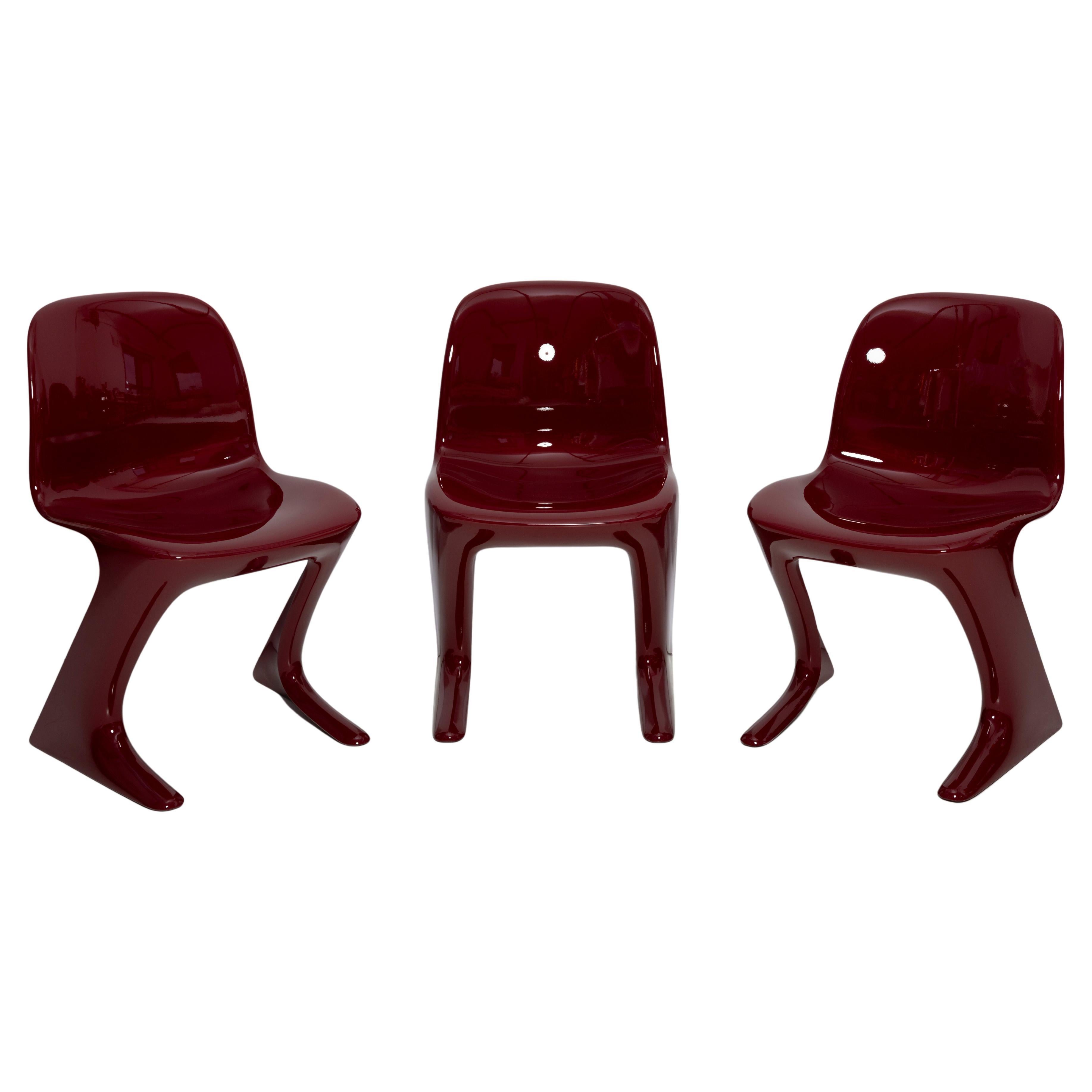 Set of Three Red Wine Kangaroo Chairs Designed by Ernst Moeckl, Germany, 1968 For Sale
