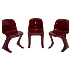 Vintage Set of Three Red Wine Kangaroo Chairs Designed by Ernst Moeckl, Germany, 1968