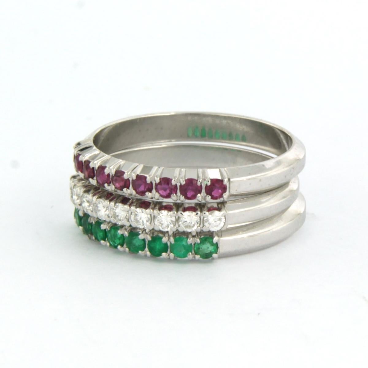 set of three ring set with ruby, emerald and brilliant cut diamond. 0.24ct - F/G - VS/SI - ring size U.S. 7 - EU. 17.25(54)

detailed description:

The total width of the set of rings is 8.2 mm wide

each ring is approximately 2.7 mm wide

Ring size
