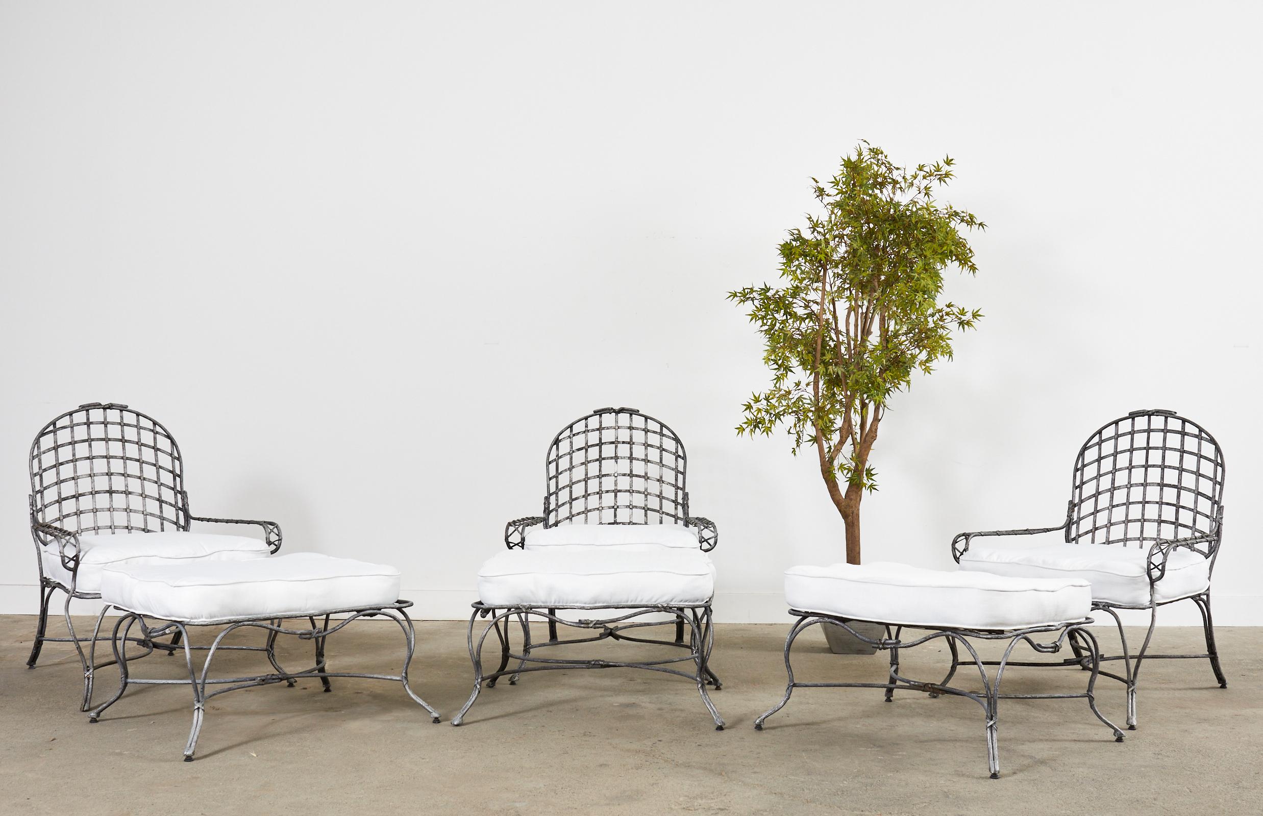 Amazing set of three iron twig patio and garden lounge chairs with matching ottomans featuring a silvered finish. Made in the style of Rose Tarlow or Gregorius Pineo by a foundry in Los Angeles, CA. The neoclassical style frames feature a faux bois