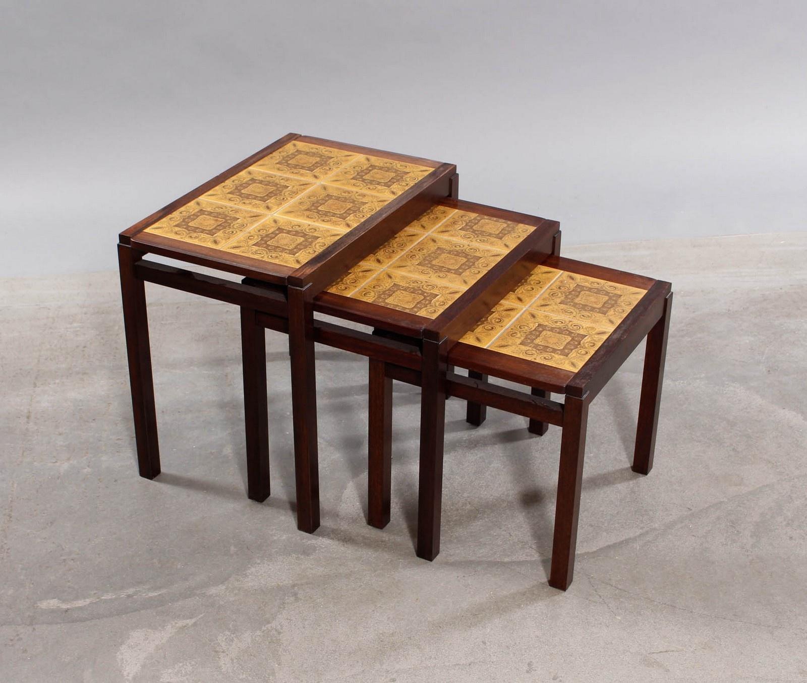 Danish furniture manufacturer. Nesting tables crafted in rosewood and decorative tiles. 