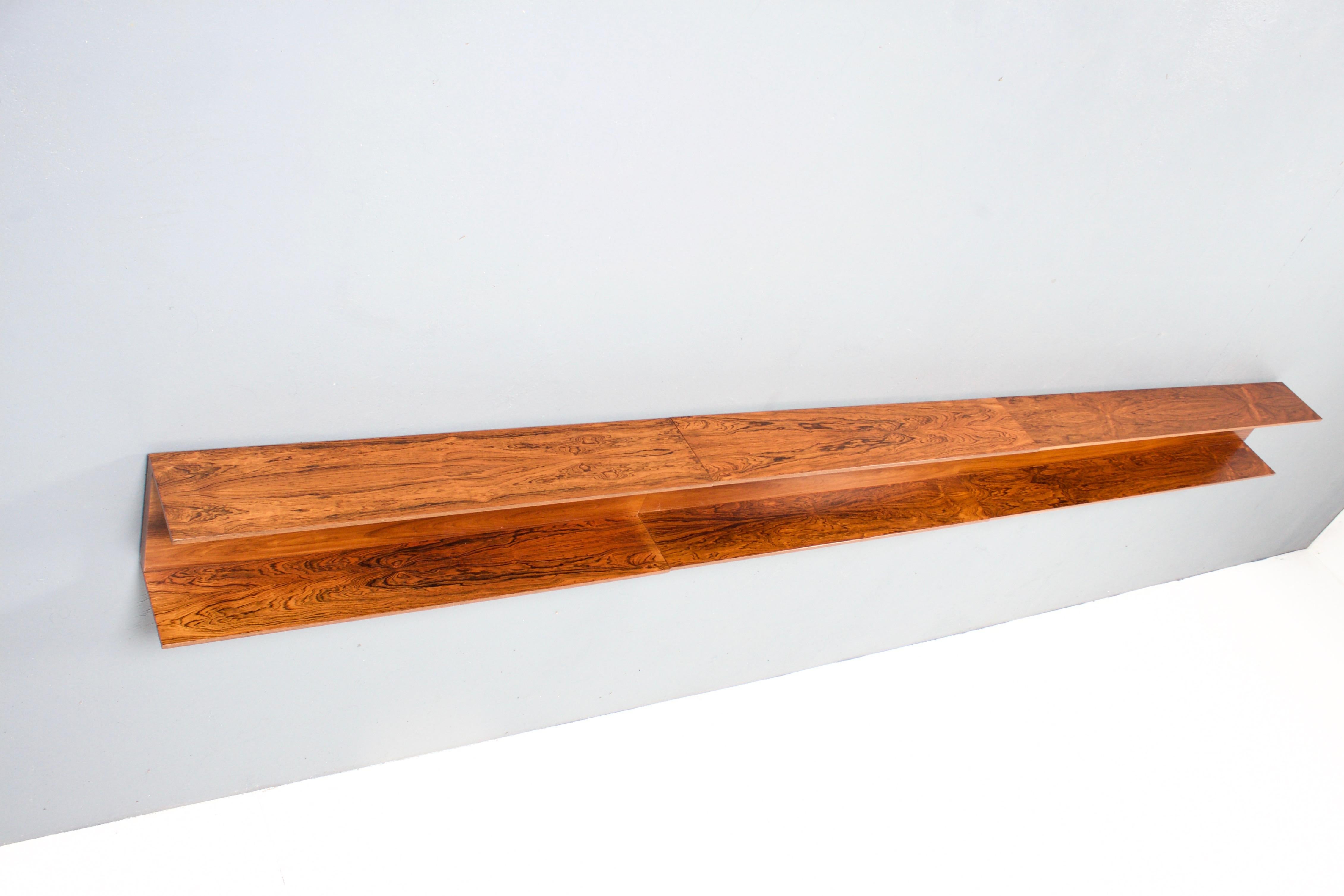 Set of three wall shelves designed by Walter Wirz in very good condition.

Manufactured by Wilhelm Renz in the 1960s.

The shelves are made of a beautiful rosewood and have a gorgeous wood grain and color. 
The rosewood version is quite rare.

The