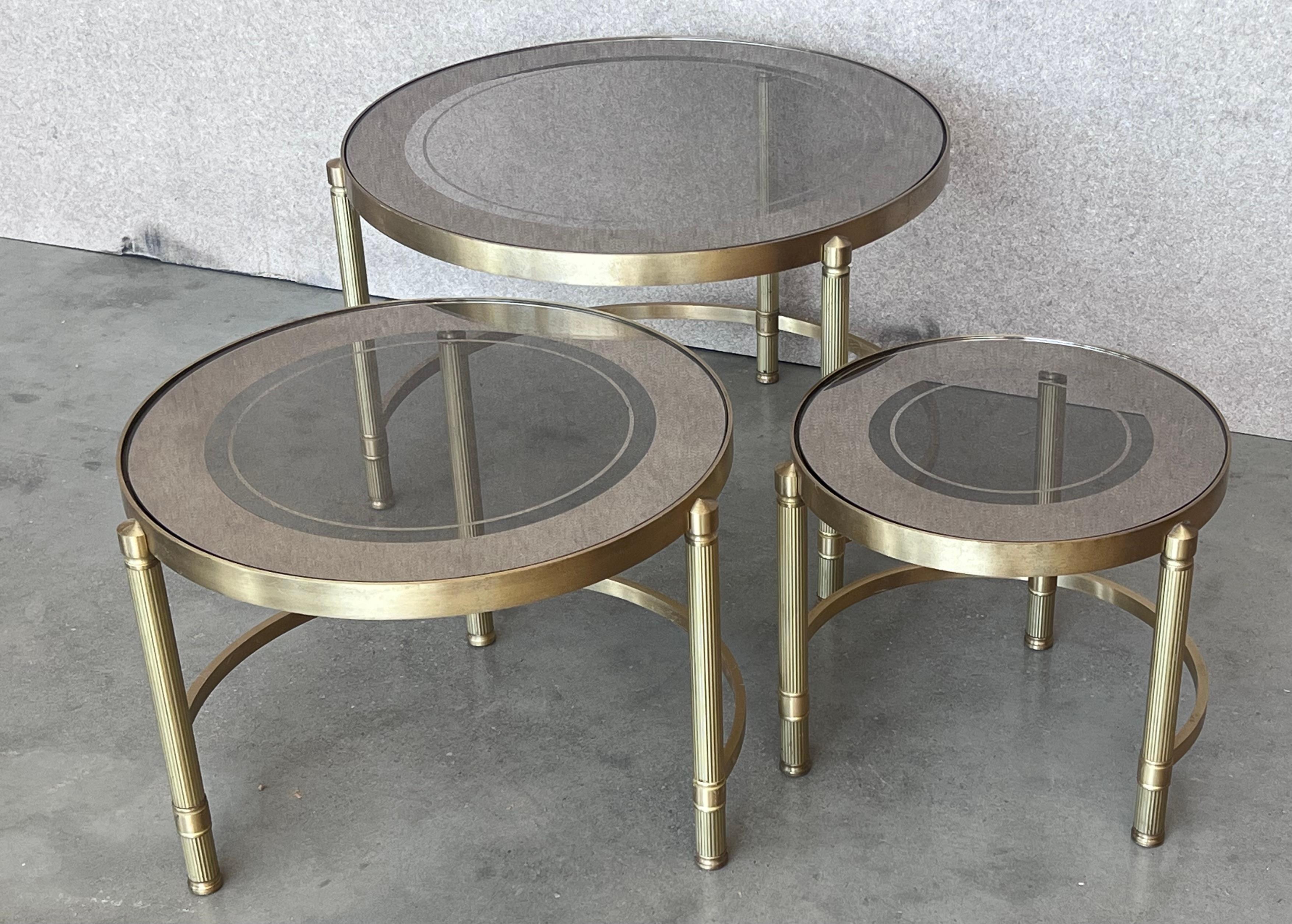 20th Century Set of Three Round Brass Nesting Tables with Smoked Pink Glass Tops For Sale