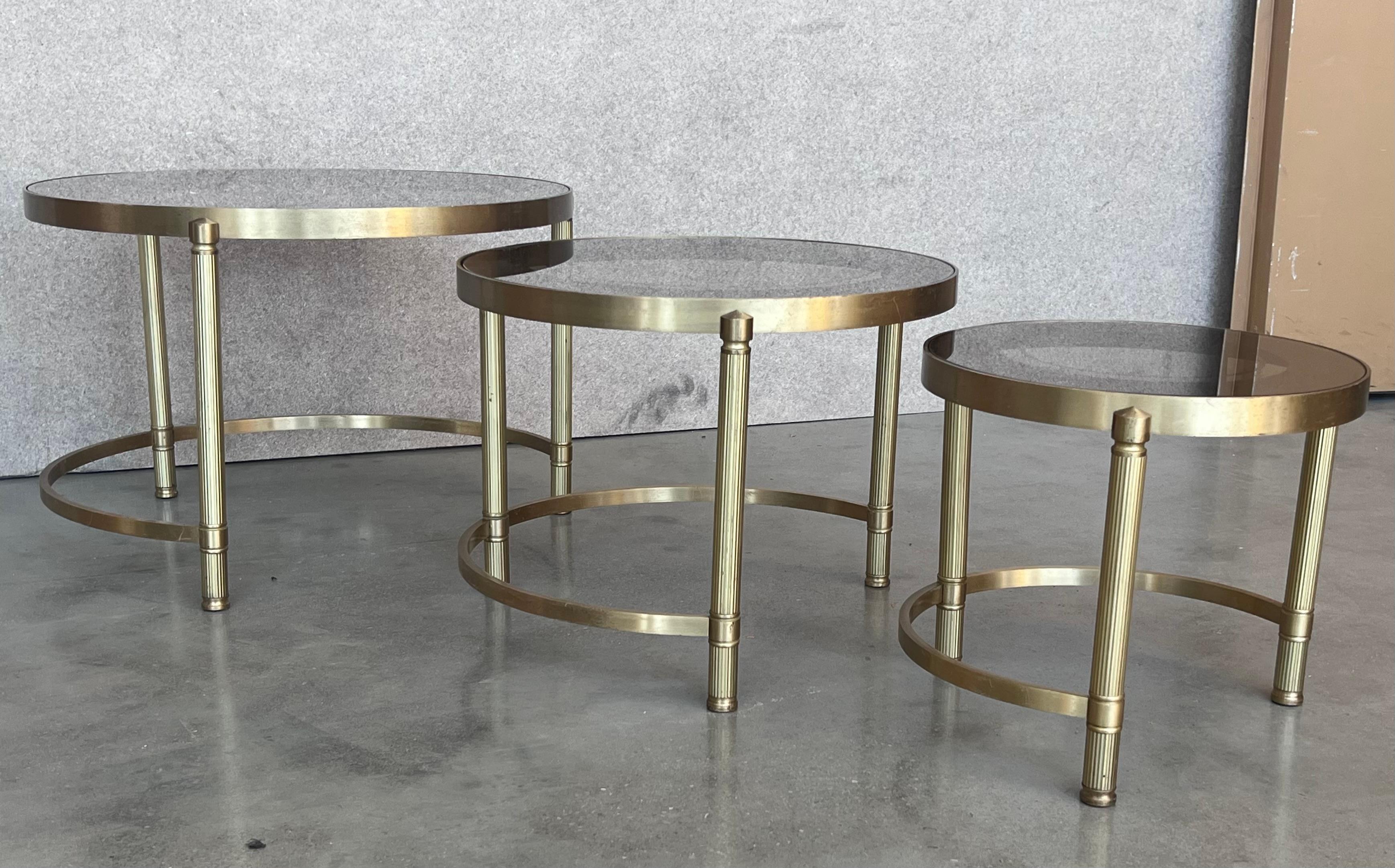 Set of Three Round Brass Nesting Tables with Smoked Pink Glass Tops For Sale 1