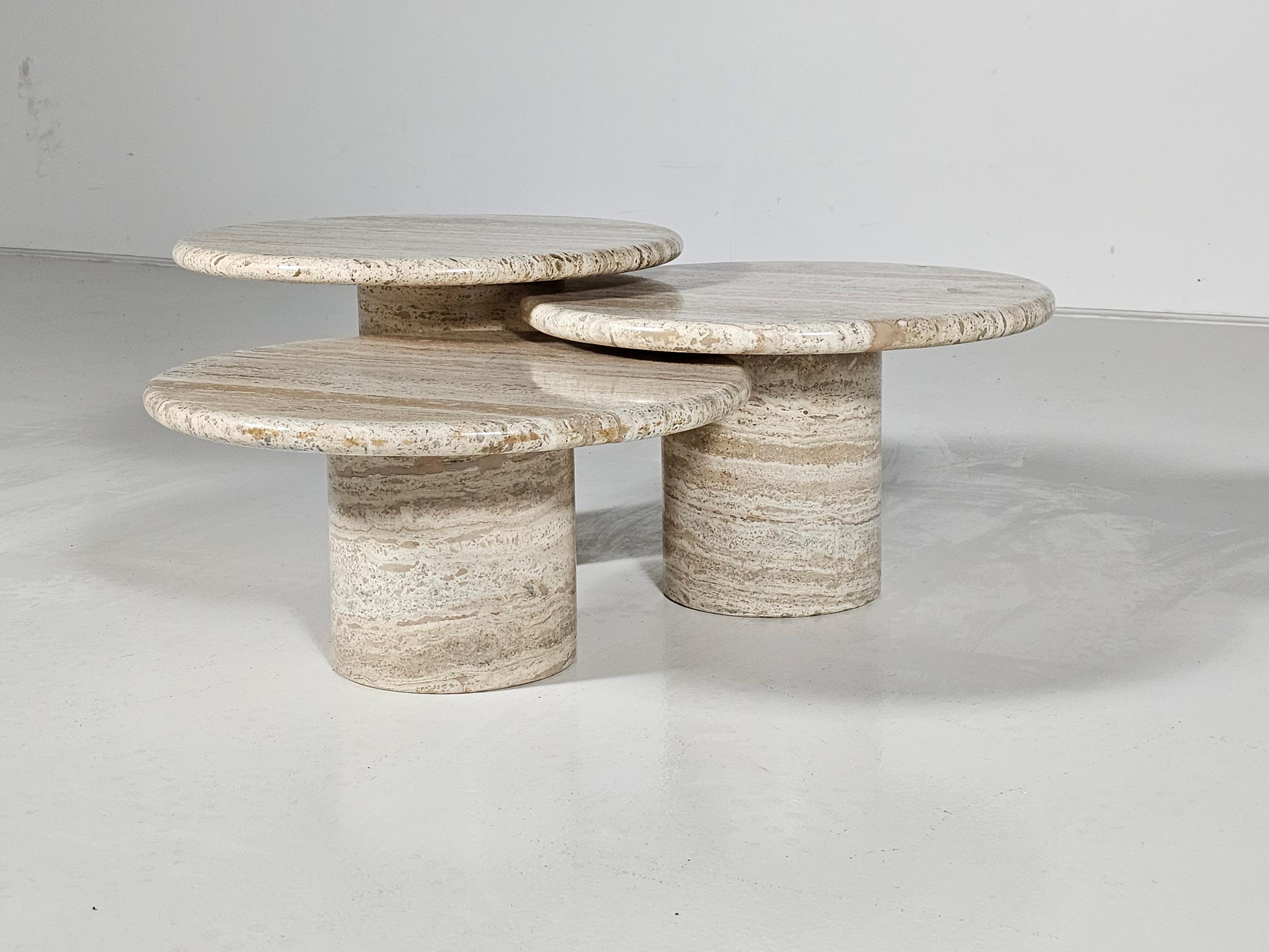 Set of three coffee tables, travertine, Italy, 1970s

This set of cocktail tables features an elegant design that clearly illustrates a balanced look. The circular tables have no joints or clamps and are architectural in their structure. Each