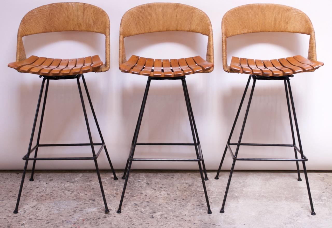 Mid-Century Modern Set of Three Rush and Iron Swiveling Stools by Arthur Umanoff, Five Available