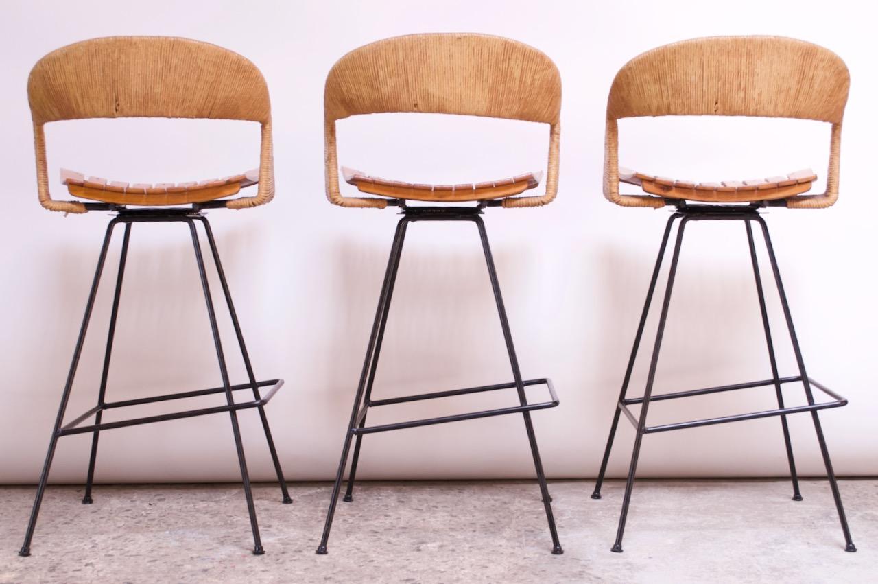 Mid-20th Century Set of Three Rush and Iron Swiveling Stools by Arthur Umanoff, Five Available