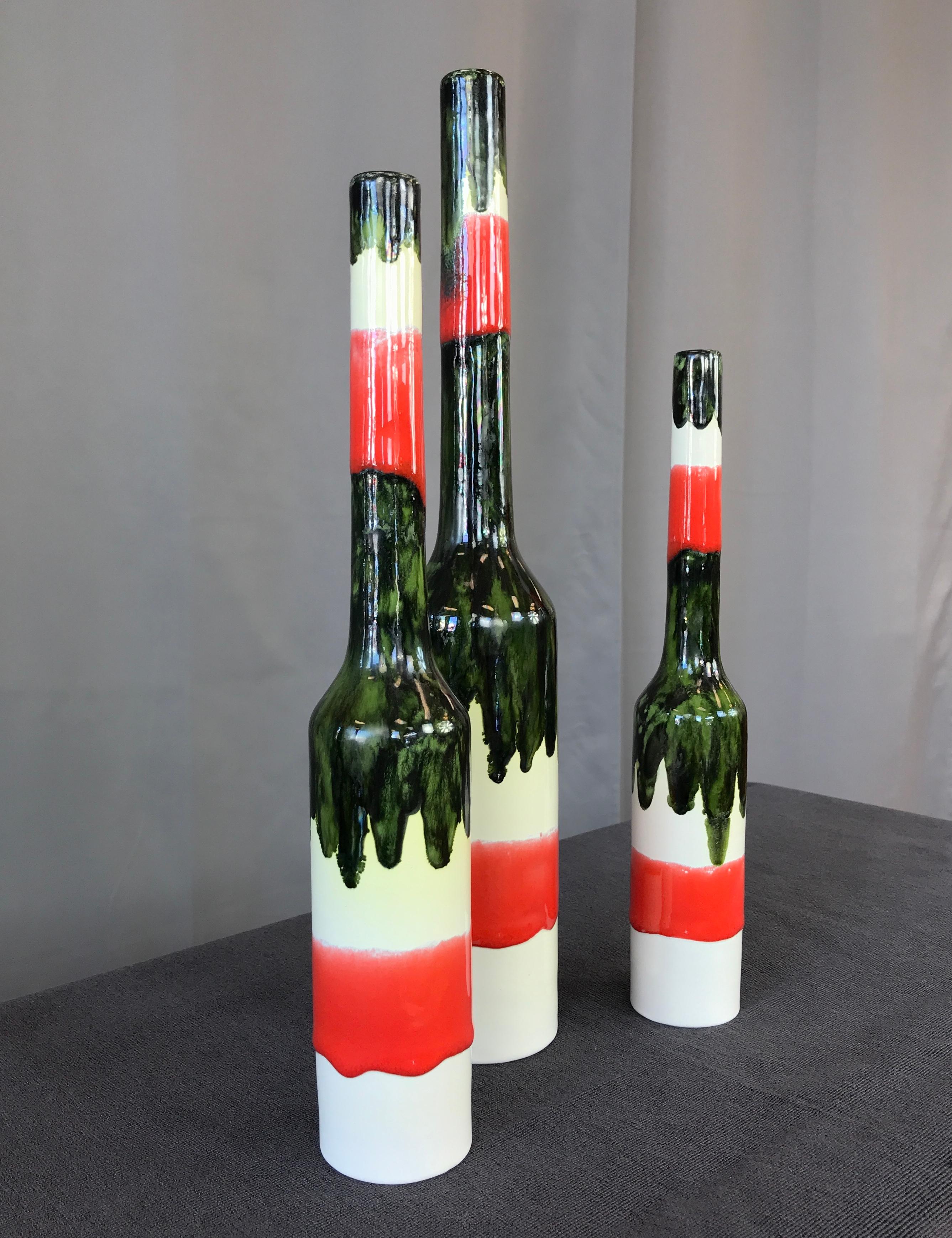 Three San Polo vases of different heights . 15 3/4, 13 1/4 and 11 5/8, circa 1950s
Ceramic and glazed, base color is a creamy white, red and a dark green.
All marked on their bottoms 

Measurement below is for the tallest one: