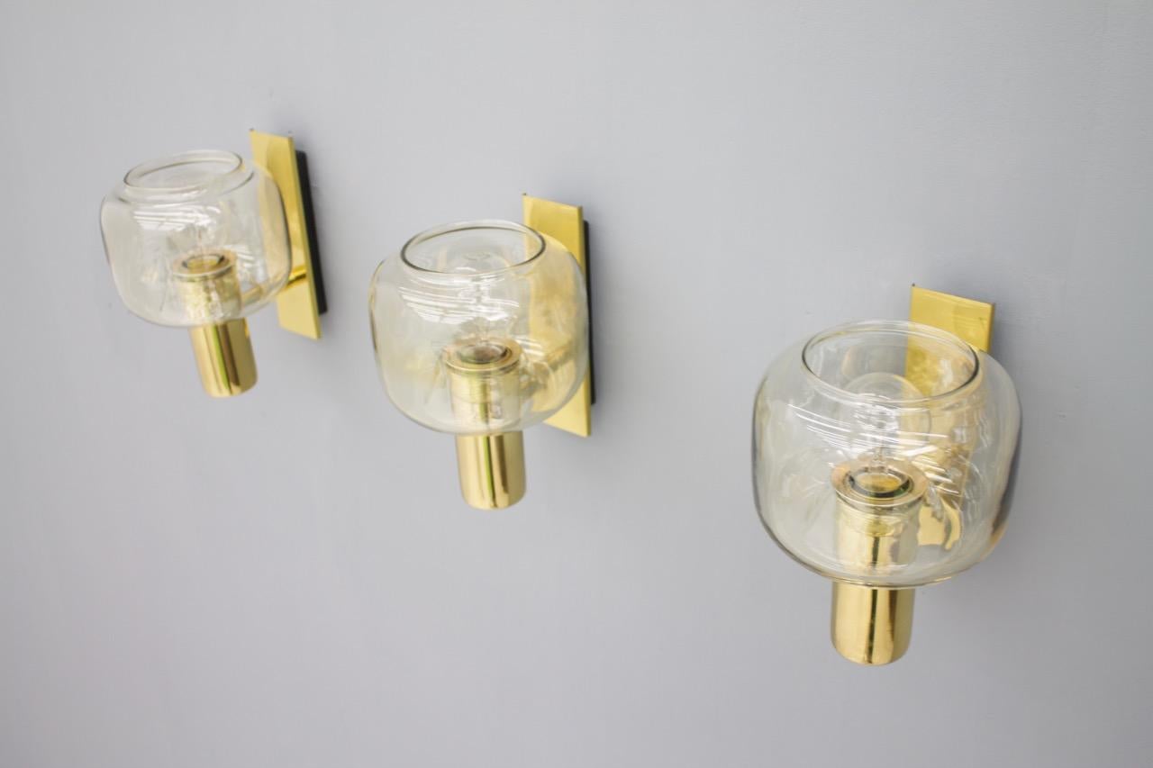 One Scandinavian brass and glass wall lights, 1960s.

only one light is available

Good condition.