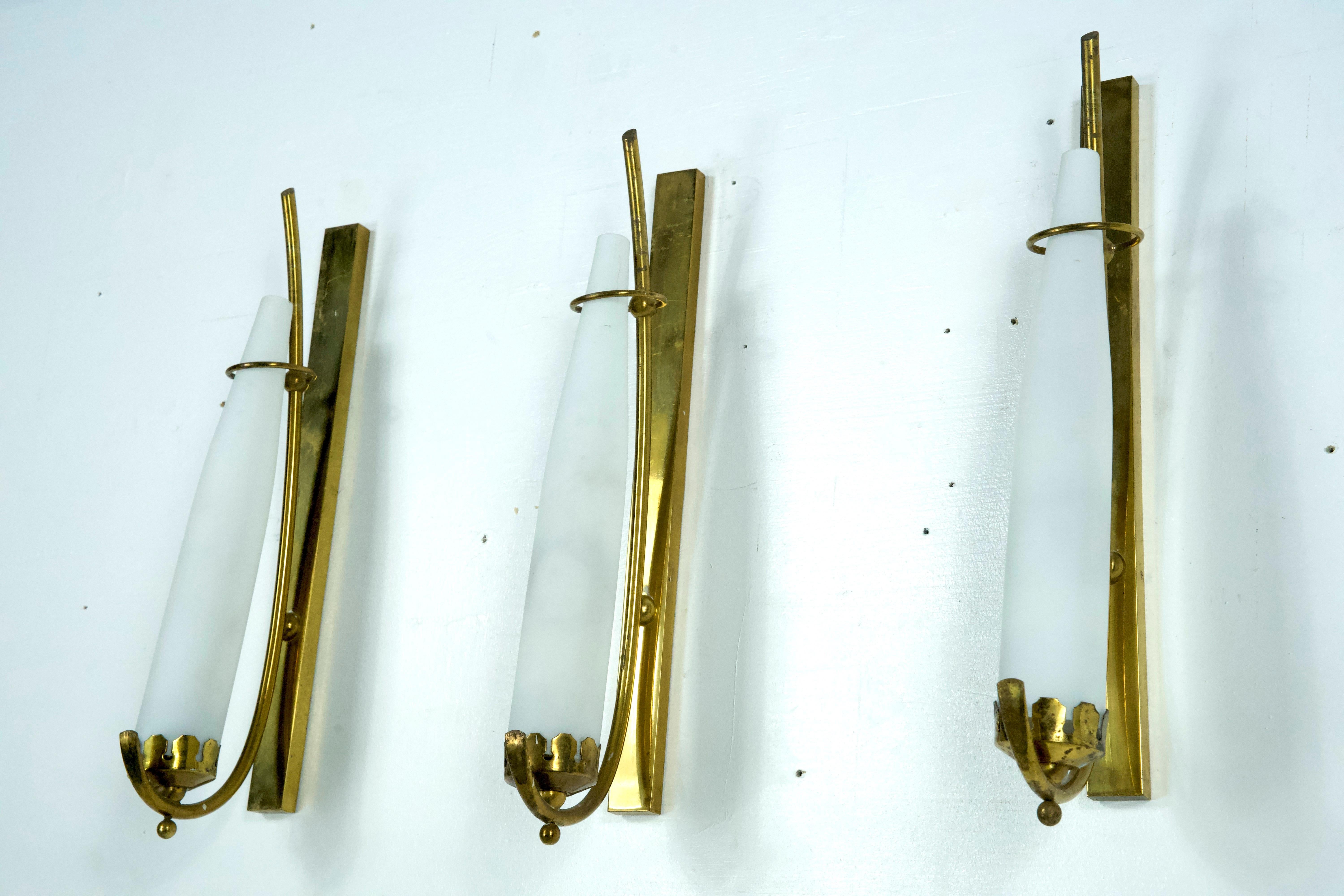 Mid-Century Modern Set of three sconces in brass and triplex opaline glass in Arredoluce manner. It For Sale