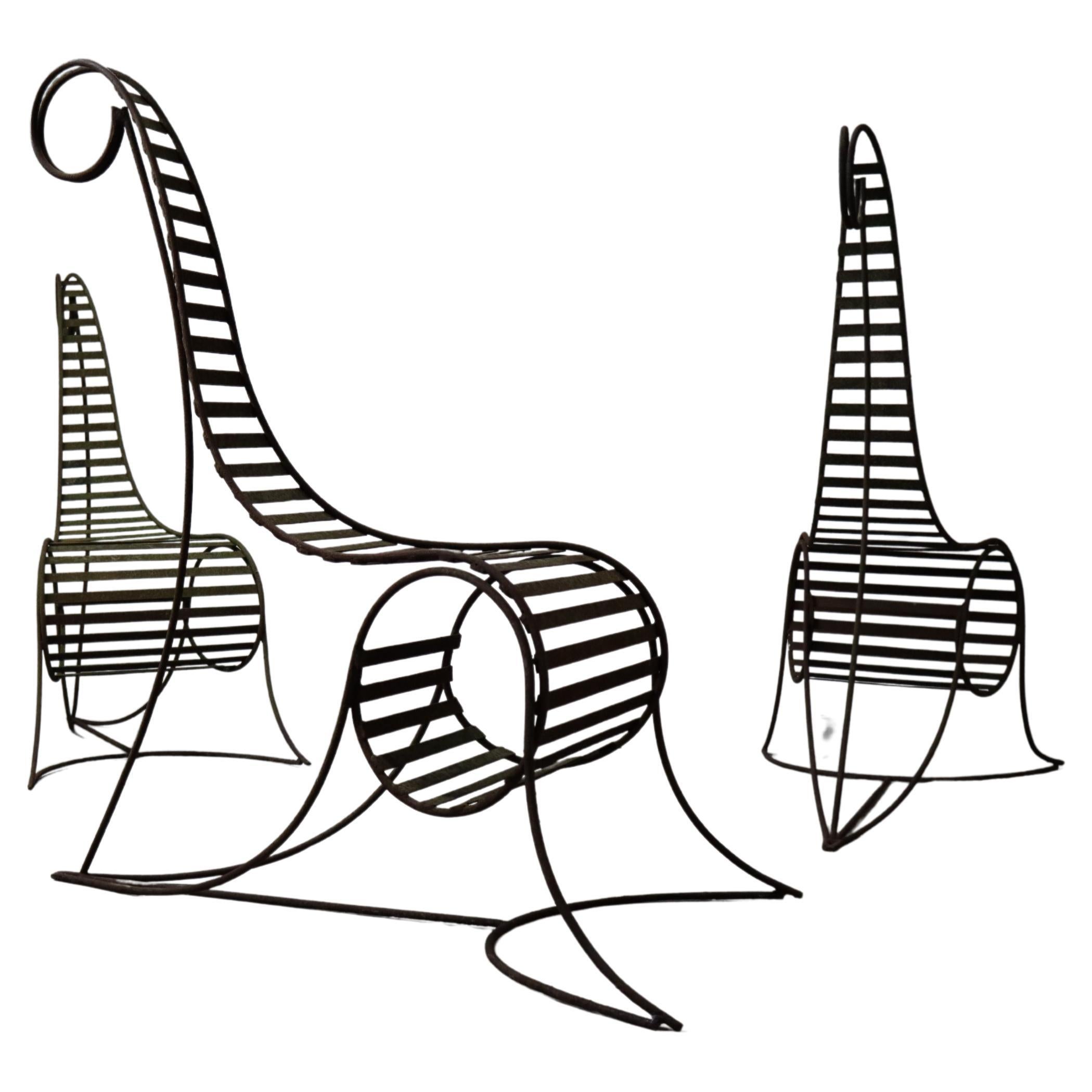 Set of three sculptural iron chairs, in the style of André Dubreuil For Sale