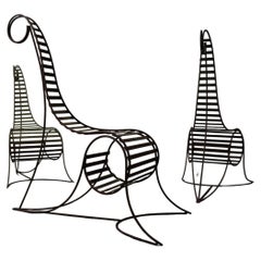 Set of three sculptural iron chairs, in the style of André Dubreuil