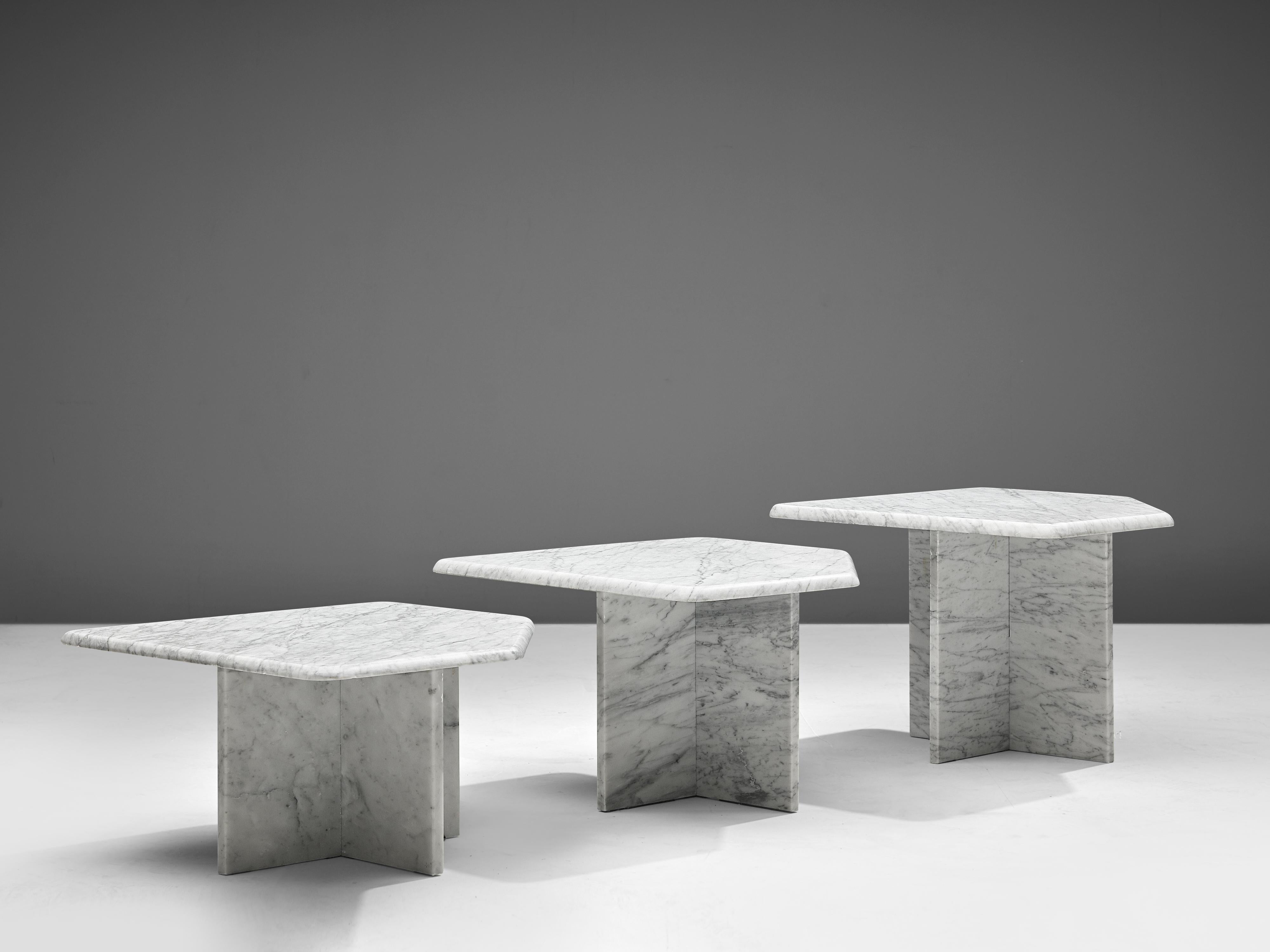 Set of three coffee tables, marble, Italy, 1970s

This set of three geometrical marble coffee tables each feature a polygonal tabletop and a x-shaped base. The aesthetics are archetypical for postmodern design, bearing references to architectural