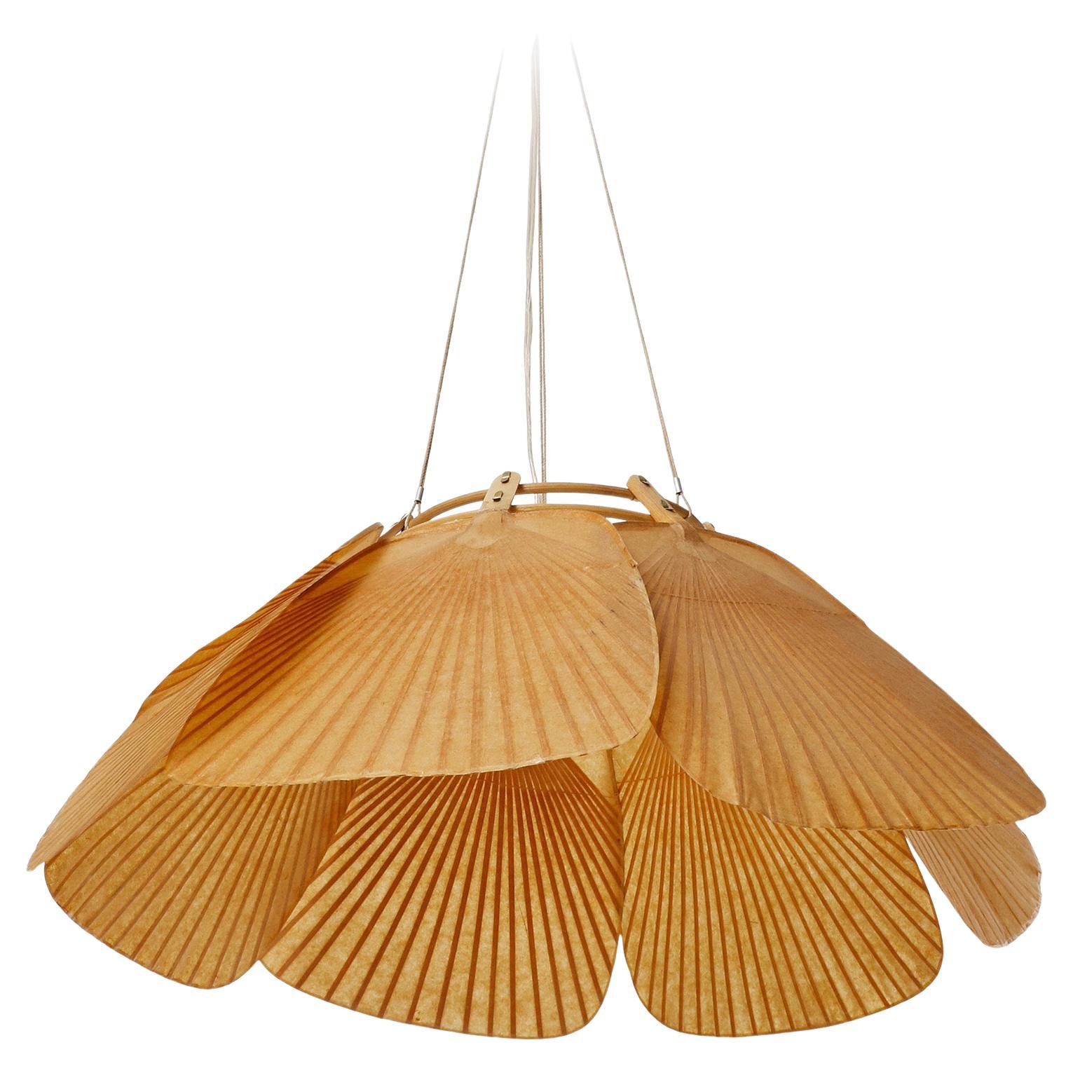 A rare set of  'Shichi' pendant light fixtures with seven rice paper fans connected to a bamboo shaft by Ingo Maurer, Germany, 1970s.
Very hard to find pieces, especially in this very good condition.
This lamp was handmade of bamboo and Japanese