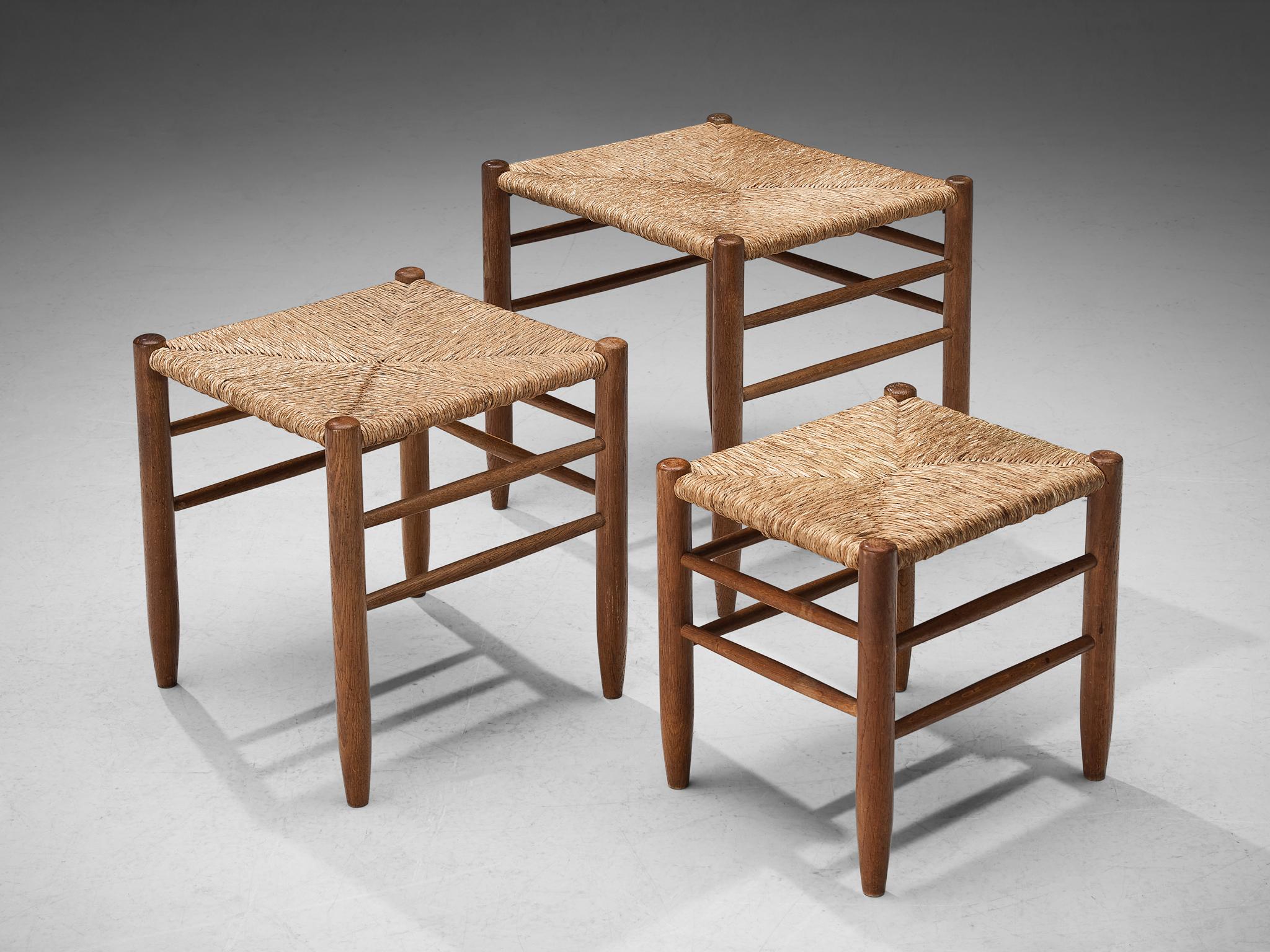 Sidetables, oak and straw, France, 1950s. 

A lovely set of three side or nesting tables. The combination of the oak and straw create a warm and comfortable look.

Measuments of biggest table are shown.

