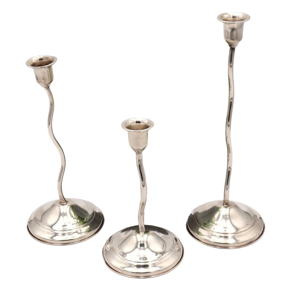 Set of three silver candlesticks For Sale