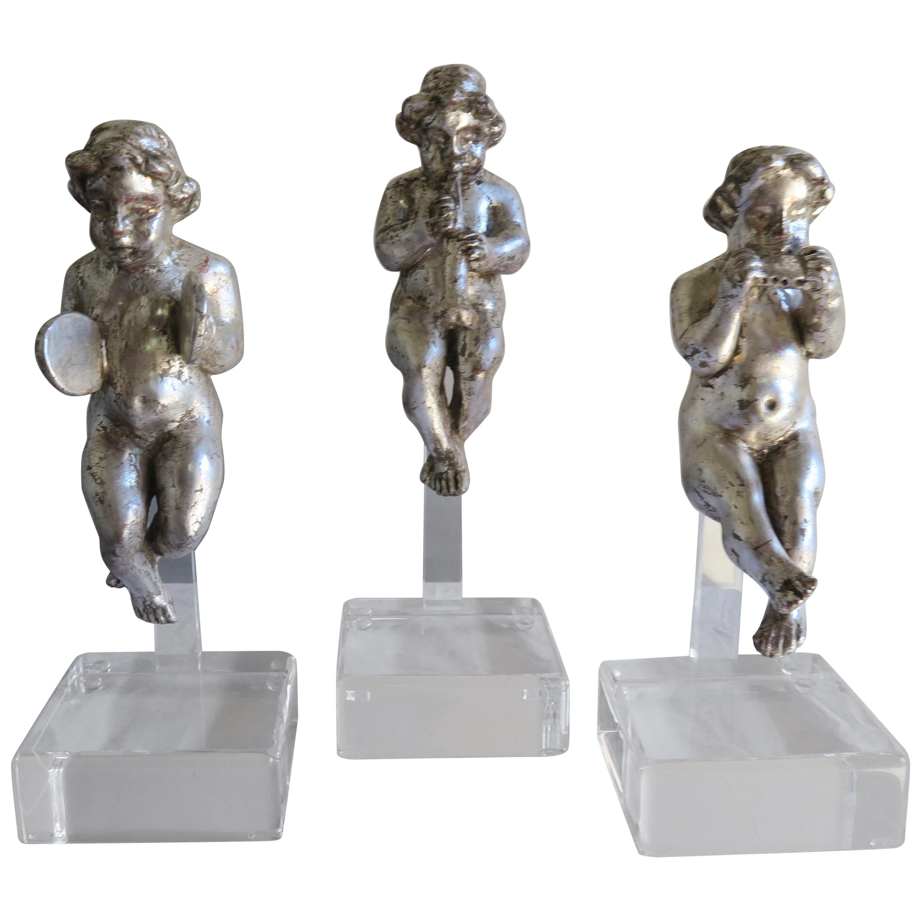 Set of Three Silver Gilt Musical Cherubs on Lucite Bases For Sale