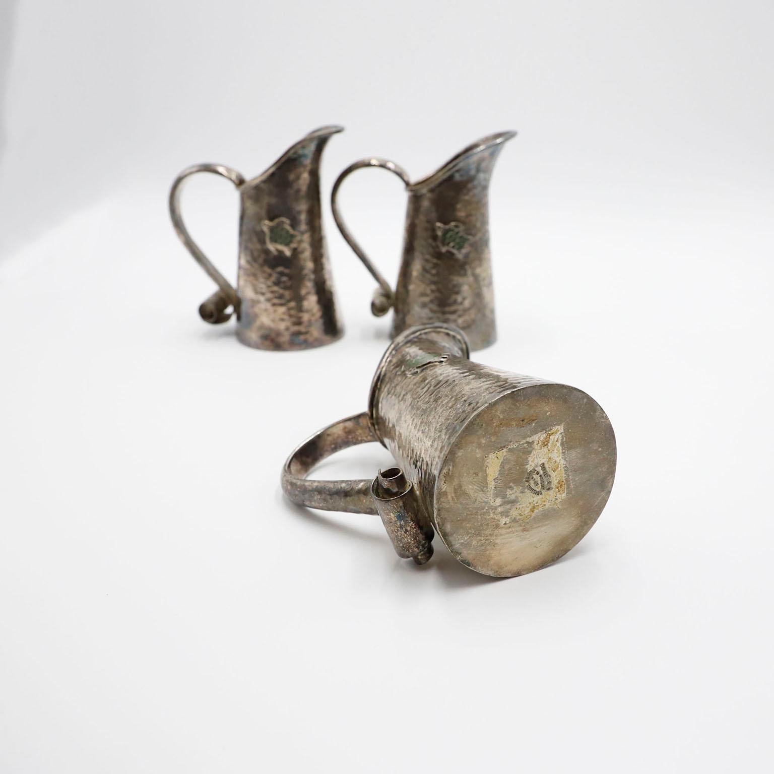 Circa 1970, we offer this fantastic Set of Three Tea Pots. made in steel and silver plated with tortoise motifs. 