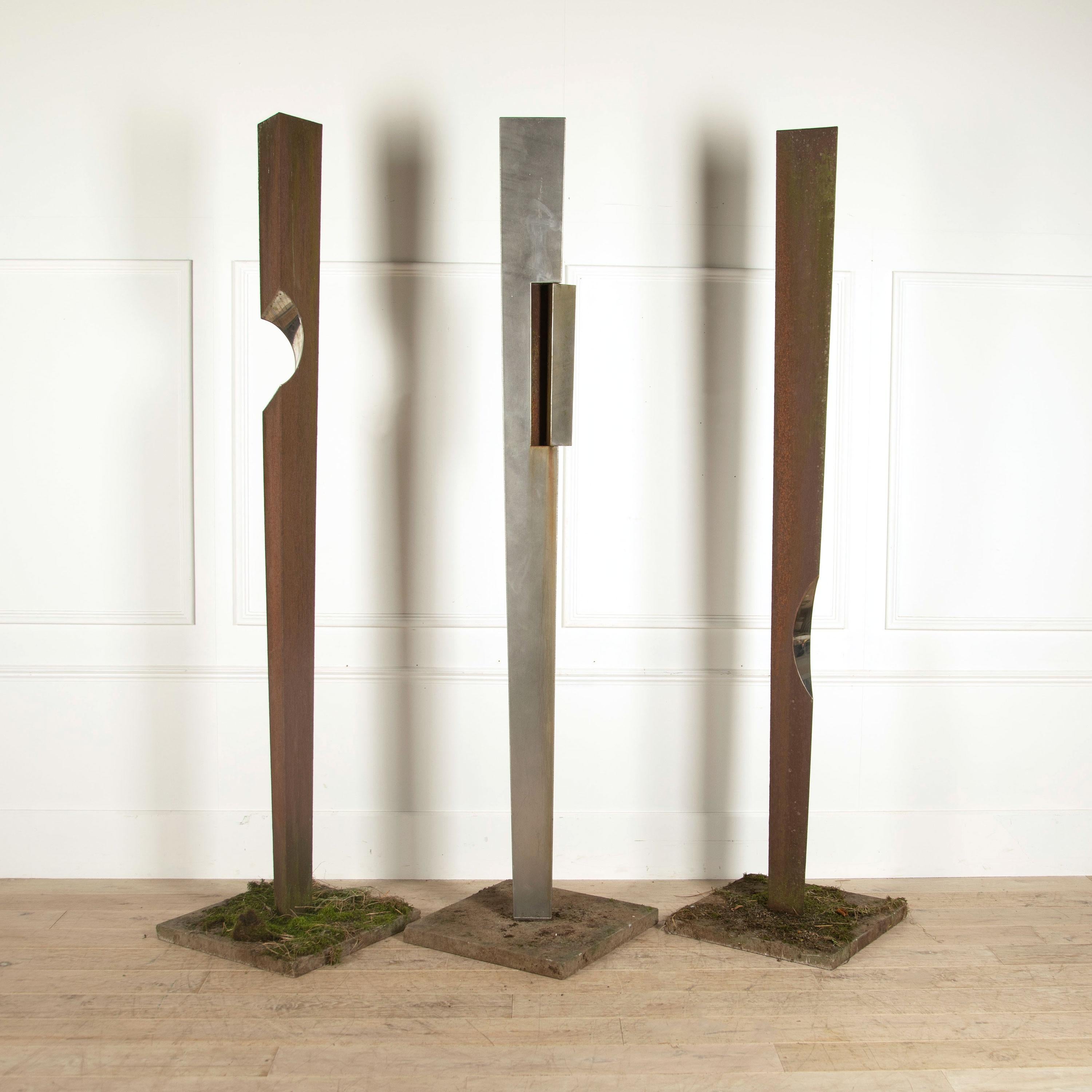 A series of three Simon Frend pillar sculptures each numbered in stainless and galvanised steel.