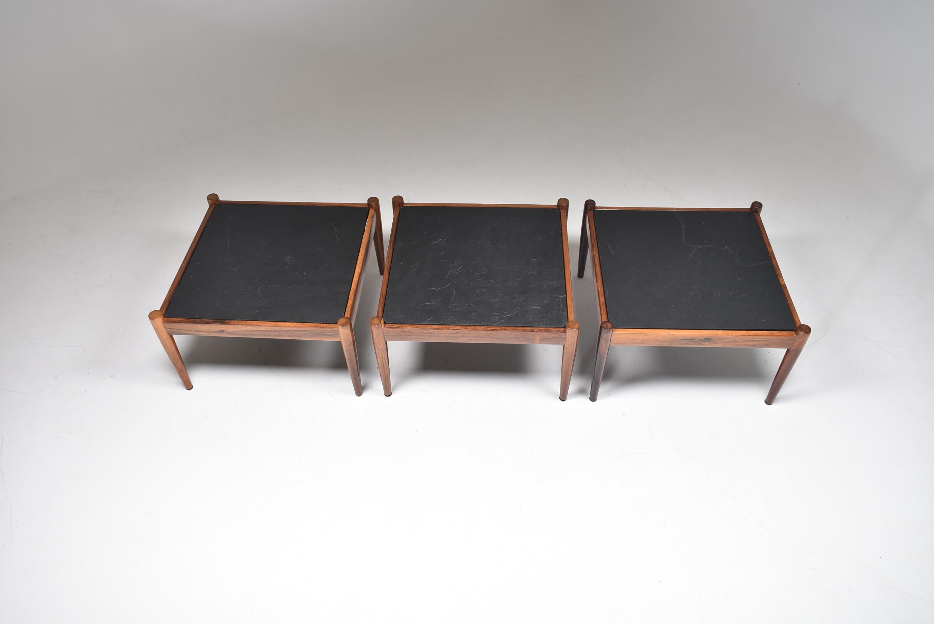 Set of three slate and rosewood coffee tables 