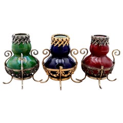 Set of three small silver and porcelain jars