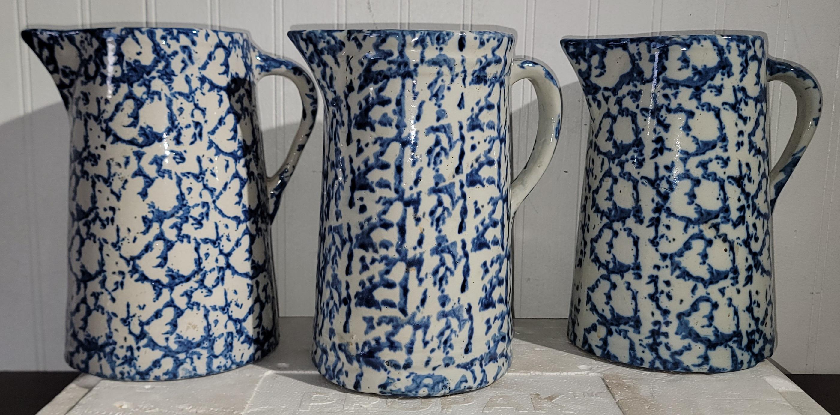 Set of Three 19thc hand made/baked sponge pottery pitchers with sponge pressed paint with a glazed over finish. 